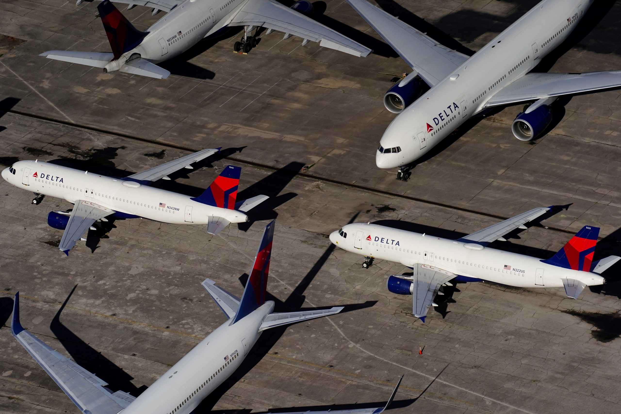 FILE PHOTO: Delta Air Lines passenger planes are seen parked due to flight reductions made to slow the spread of coronavirus disease (COVID-19), at Birmingham-Shuttlesworth International Airport in Birmingham, Alabama, U.S. March 25, 2020.  REUTERS