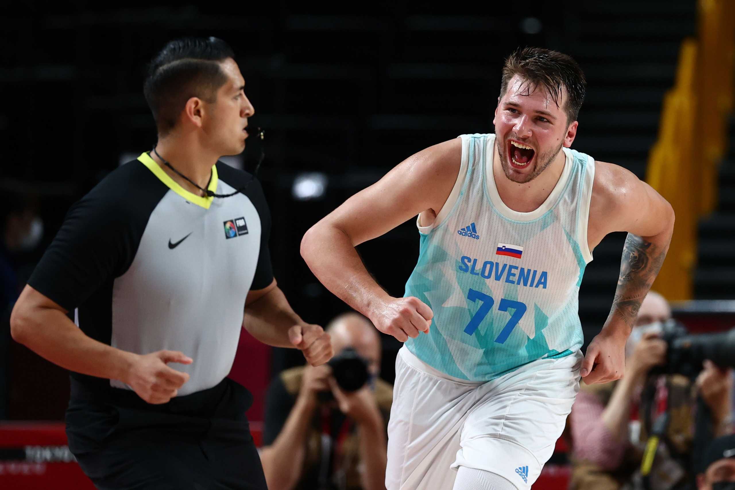 Tokyo 2020 Olympics - Basketball - Men - Quarterfinal - Slovenia v Germany - Saitama Super Arena, Saitama, Japan - August 3, 2021. Luka Doncic of Slovenia celebrates after scoring a basket REUTERS