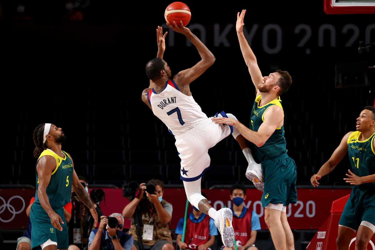 Tokyo 2020 Olympics - Basketball - Men - Semifinal - United States v Australia - Saitama Super Arena, Saitama, Japan - August 5, 2021. Kevin Durant of the United States in action with Nicholas Kay of Australia REUTERS
