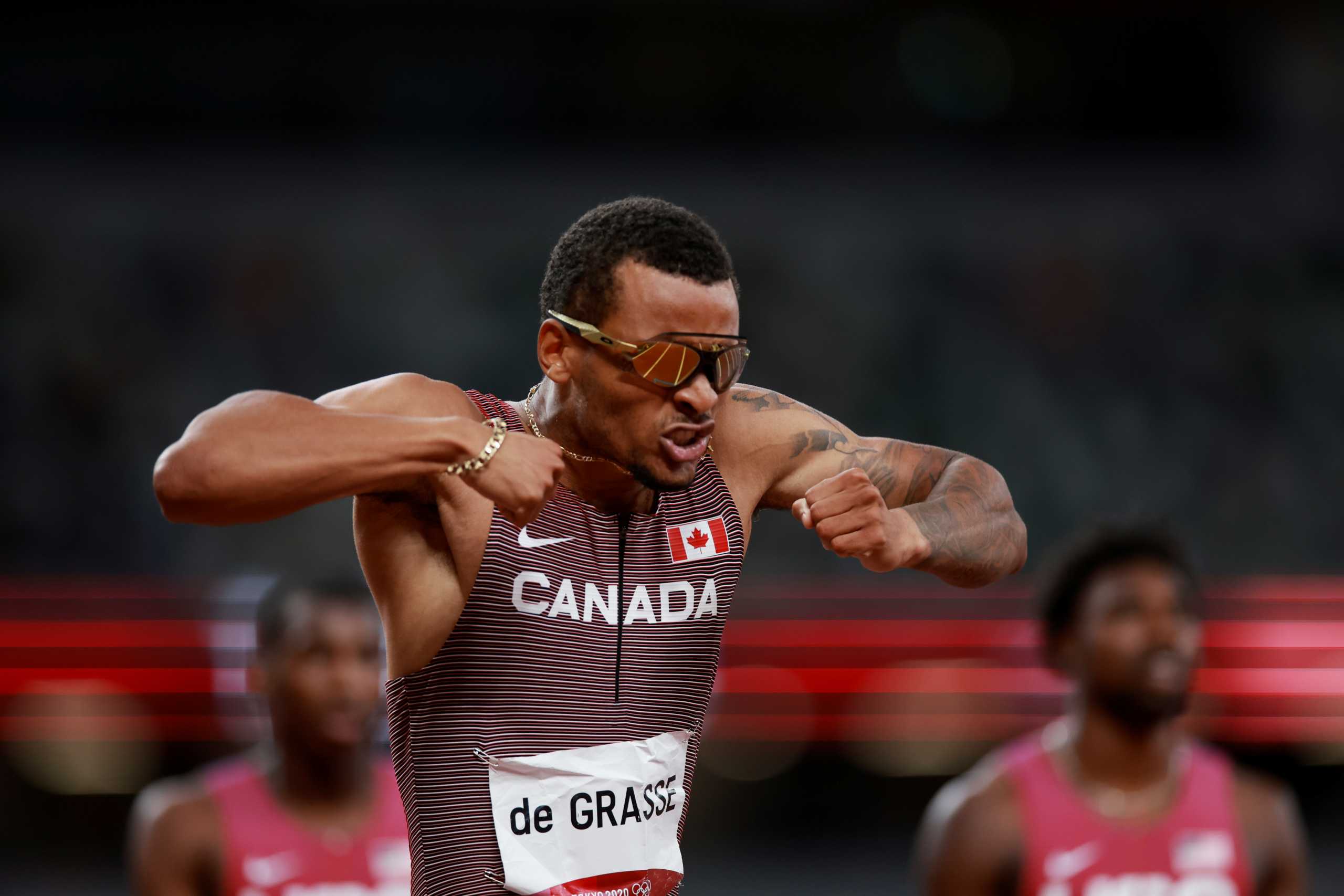 Tokyo 2020 Olympics - Athletics - Men's 200m - Final - Olympic Stadium, Tokyo, Japan - August 4, 2021. Andre De Grasse of Canada celebrates after winning gold REUTERS