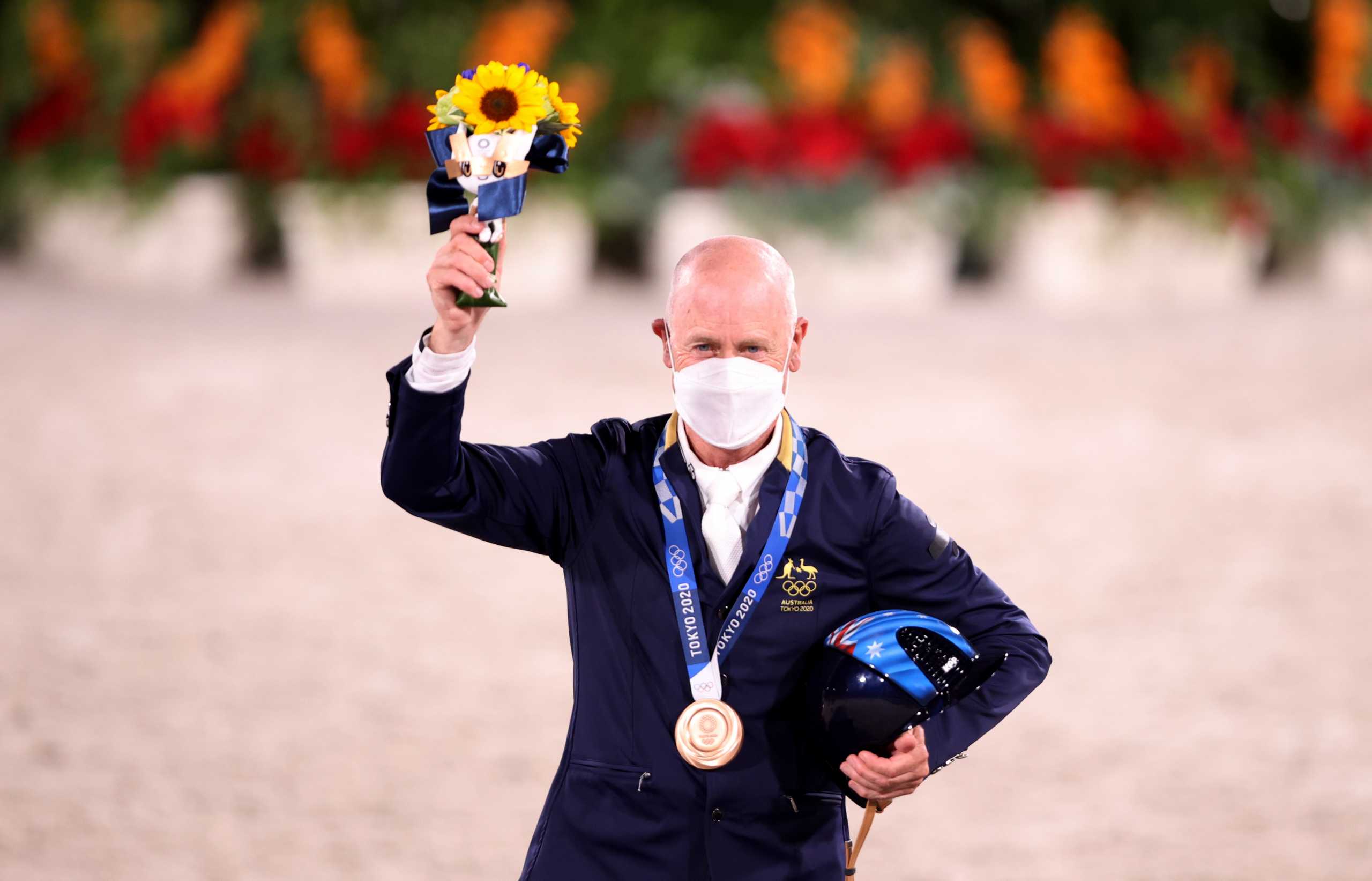 Tokyo 2020 Olympics - Equestrian - Eventing - Individual - Medal Ceremony - Equestrian Park - Tokyo, Japan - August 2, 2021. Bronze medallist Andrew Hoy of Australia celebrates. REUTERS