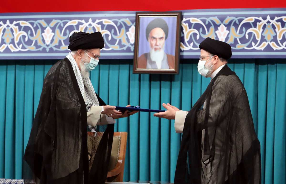 Iran's new President Ebrahim Raisi receives the endorsement decree for his presidency from Iran's Supreme Leader Ayatollah Ali Khamenei, in Tehran, Iran August 3, 2021. The Official Khamenei Website