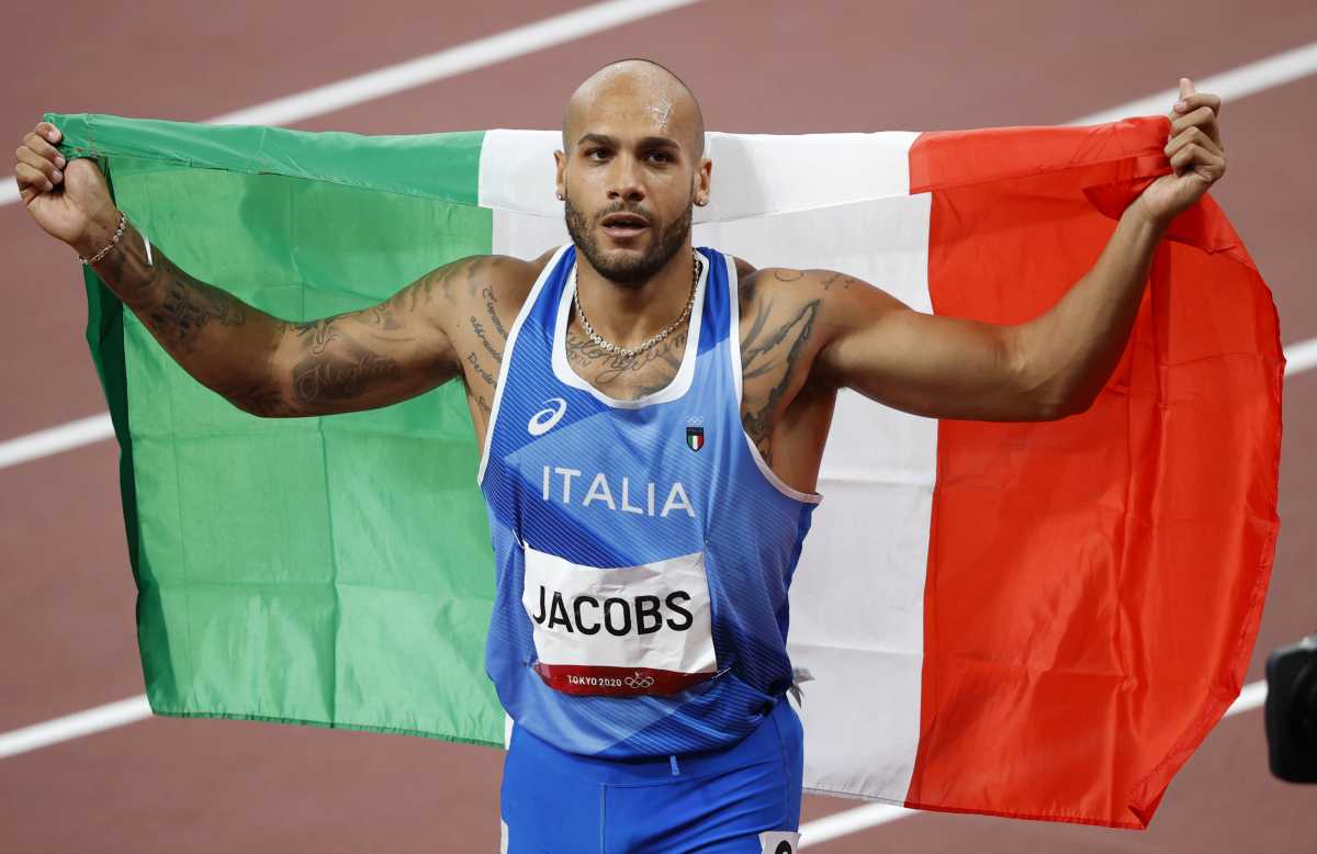 Tokyo 2020 Olympics - Athletics - Men's 100m - Final - OLS - Olympic Stadium, Tokyo, Japan - August 1, 2021. Lamont Marcell Jacobs of Italy celebrates after winning gold REUTERS
