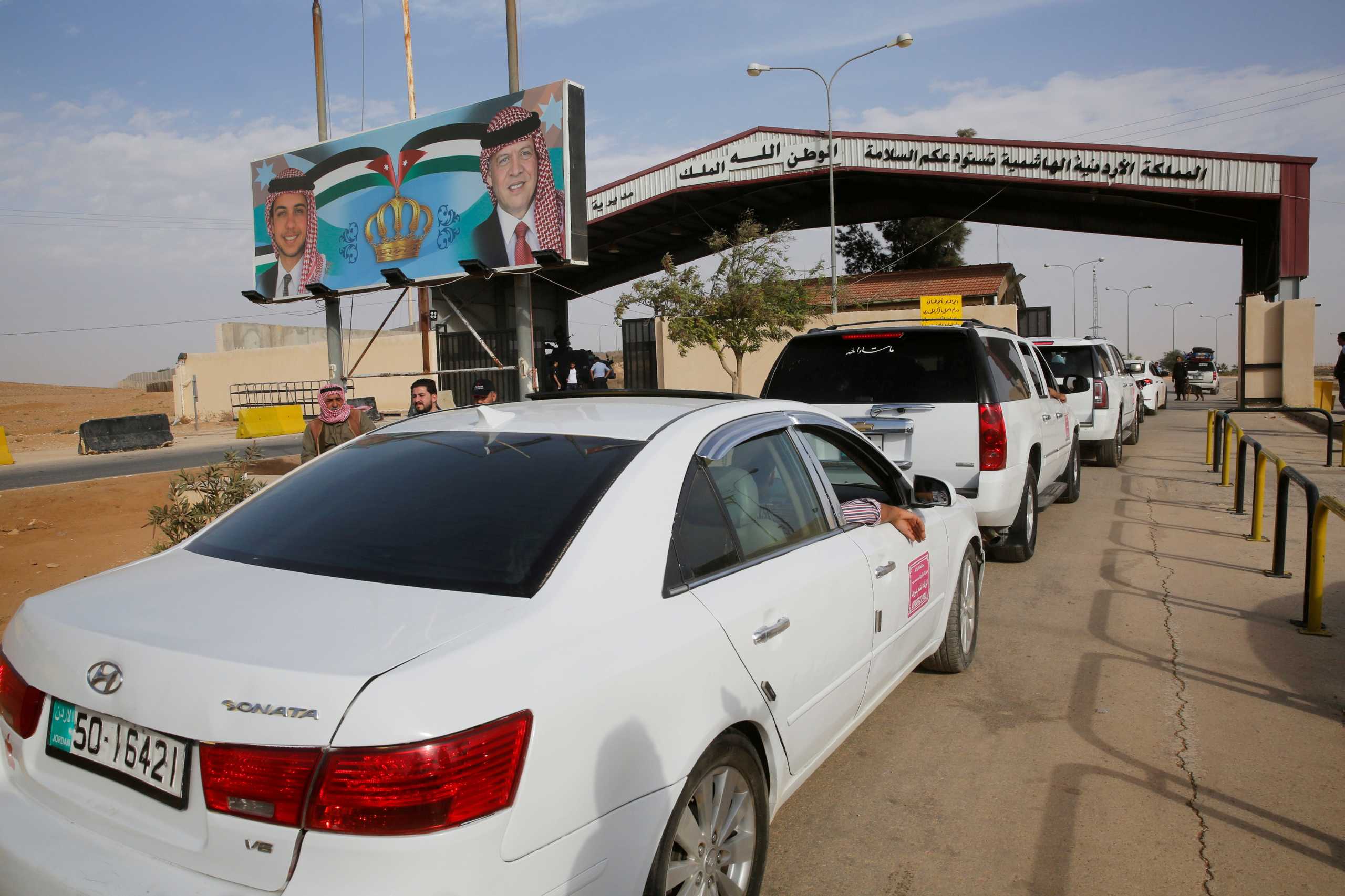 FILE PHOTO: Jordanian police officers check the cars at Jordan's Jaber border crossing, near Syria's Nassib checkpoint, near Mafraq, Jordan, October 25, 2018. REUTERS