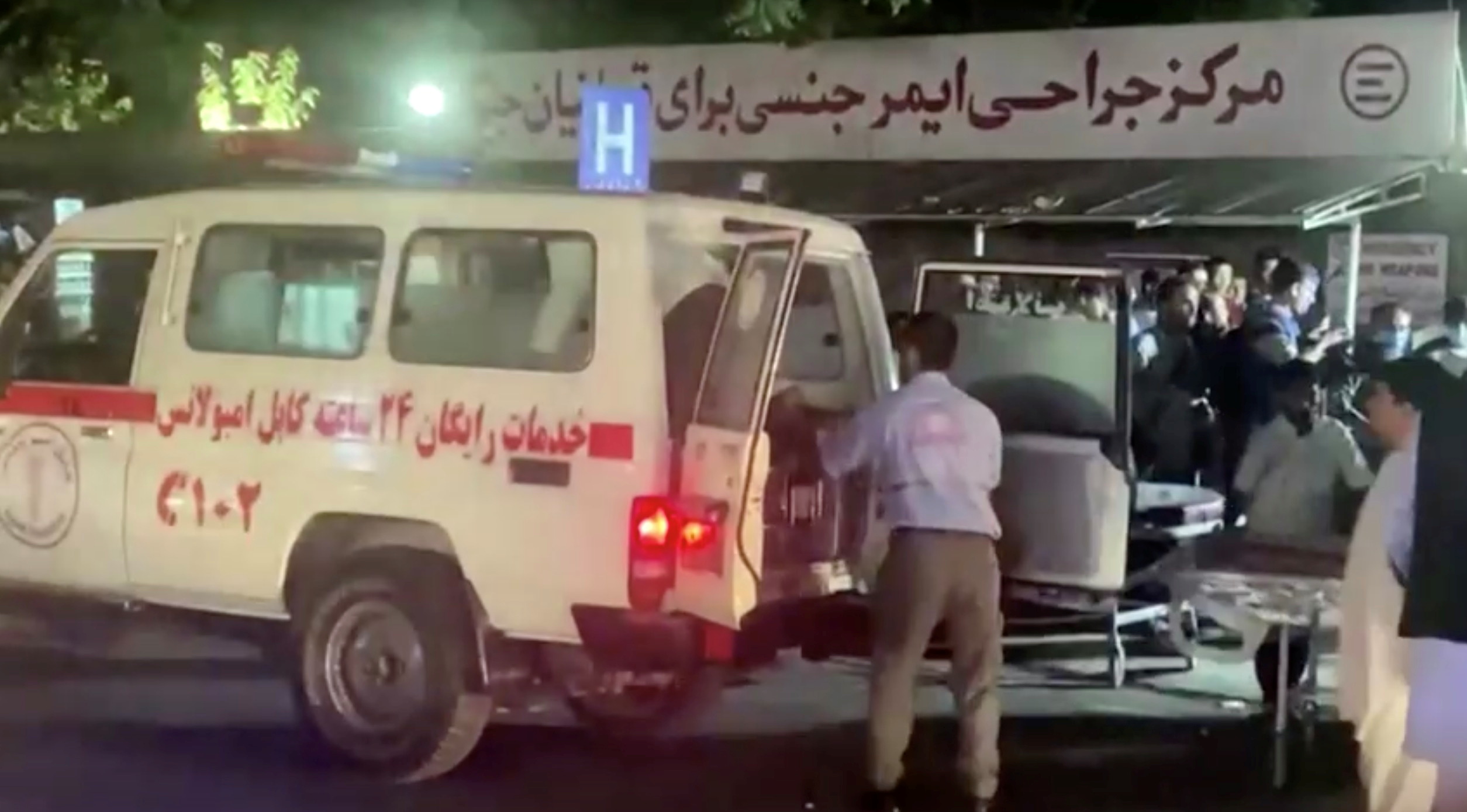 A screen grab shows an emergency vehicle as people arrive at a hospital after an attack at Kabul airport, in Kabul, Afghanistan August 26, 2021. REUTERS TV