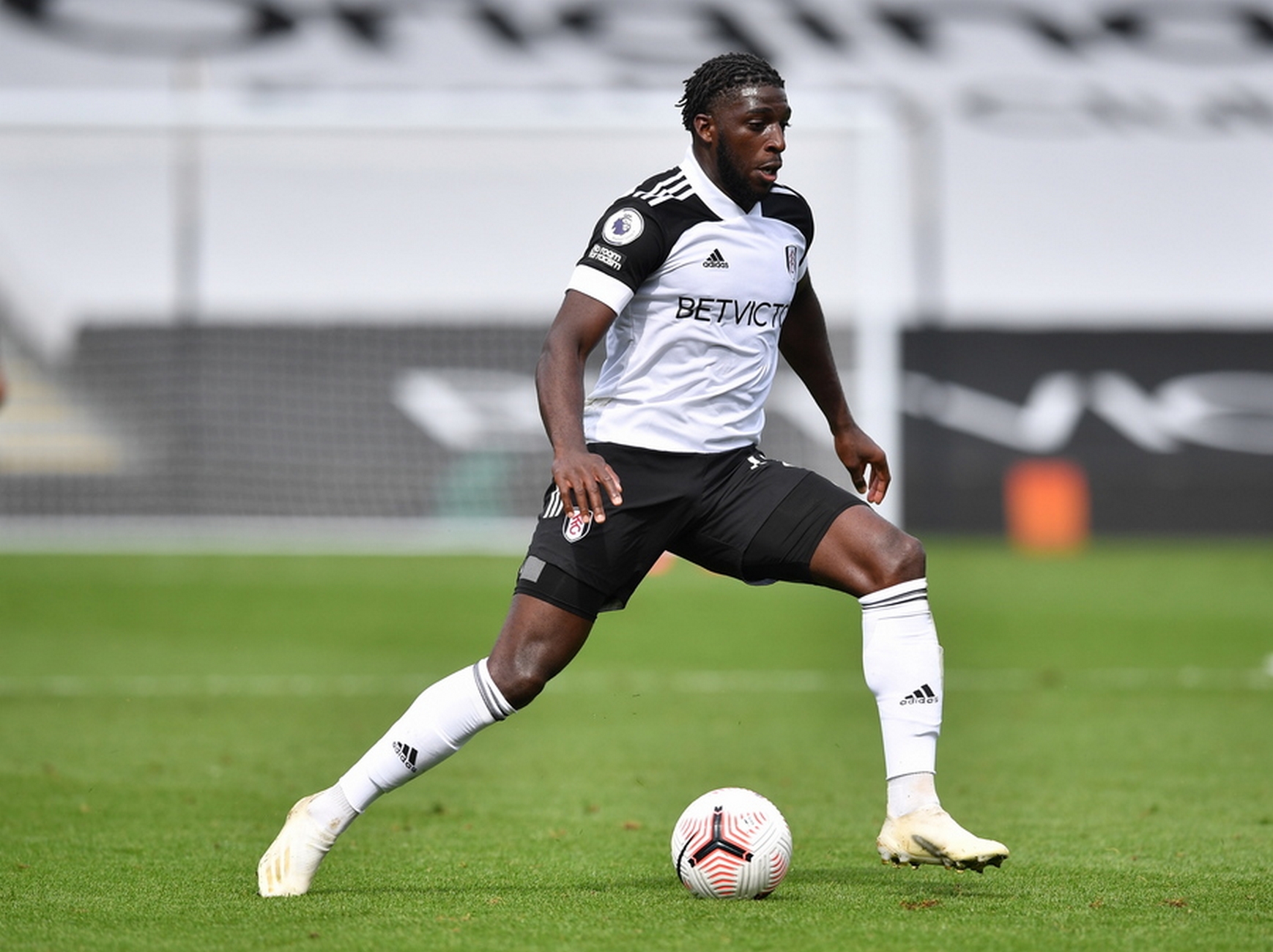 epa08663681 Aboubakar Kamara of Fulham in action during the English Premier League match between Fulham and Arsenal London in London, Britain, 12 September 2020.  EPA