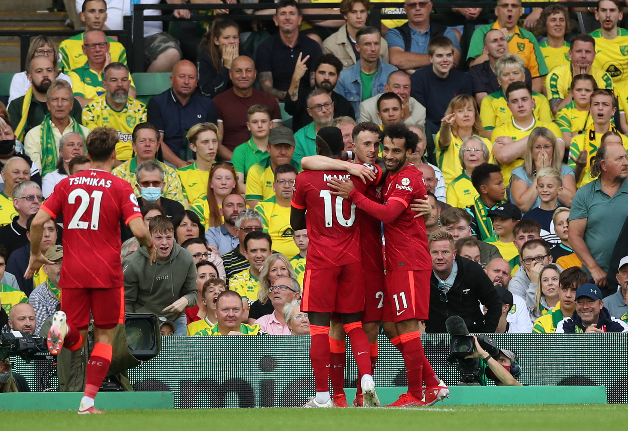 Soccer Football - Premier League - Norwich City v Liverpool - Carrow Road, Norwich, Britain - August 14, 2021 Liverpool's Diogo Jota celebrates scoring their first goal with teammates Action Images via Reuters