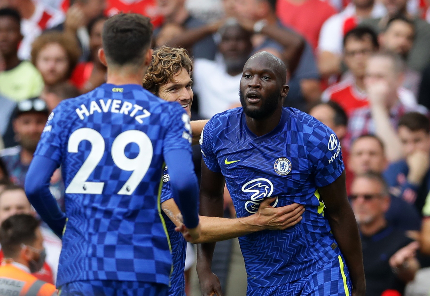 Soccer Football - Premier League - Arsenal v Chelsea - Emirates Stadium, London, Britain - August 22, 2021 Chelsea's Romelu Lukaku celebrates scoring their first goal with Marcos Alonso and Kai Havertz REUTERS