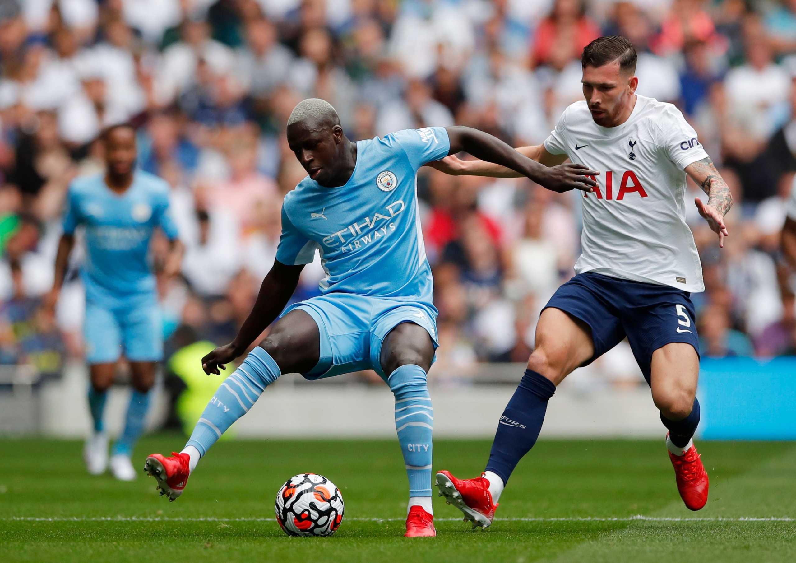 Soccer Football - Premier League - Tottenham Hotspur v Manchester City - Tottenham Hotspur Stadium, London, Britain - August 15, 2021  Manchester City's Benjamin Mendy in action with Tottenham Hotspur's Pierre-Emile Hojbjerg Action Images via Reuters