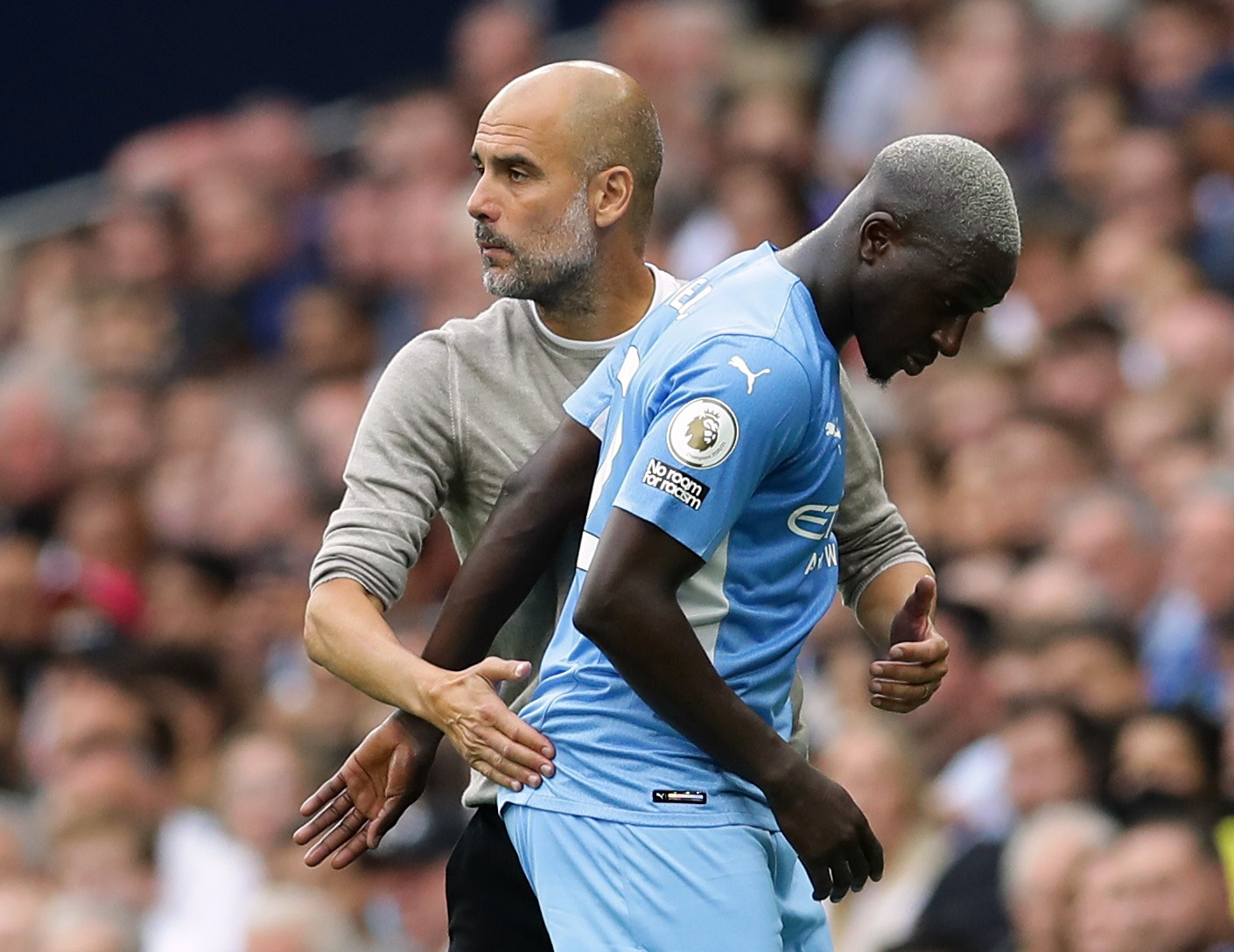 Soccer Football - Premier League - Tottenham Hotspur v Manchester City - Tottenham Hotspur Stadium, London, Britain - August 15, 2021 Manchester City's Benjamin Mendy with manager Pep Guardiola after being substituted REUTERS