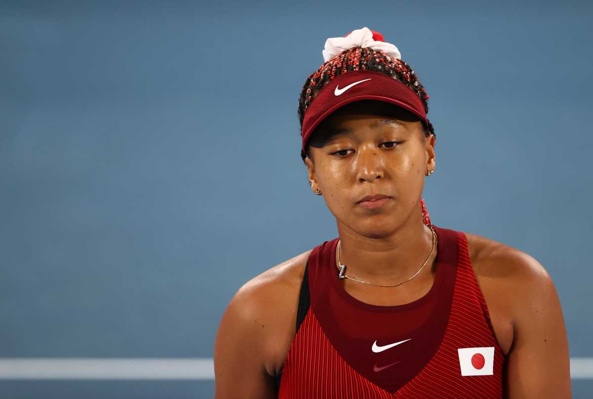 Tokyo 2020 Olympics - Tennis - Women's Singles - Round 3 - Ariake Tennis Park - Tokyo, Japan - July 27, 2021. Naomi Osaka of Japan reacts during her third round match against Marketa Vondrousova of Czech Republic REUTERS