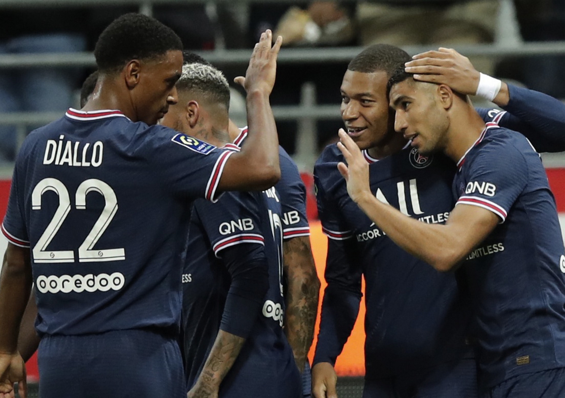 Soccer Football - Ligue 1 - Stade de Reims v Paris St Germain - Stade Auguste-Delaune, Reims, France - August 29, 2021 Paris St Germain's Kylian Mbappe celebrates scoring their second goal with teammates REUTERS