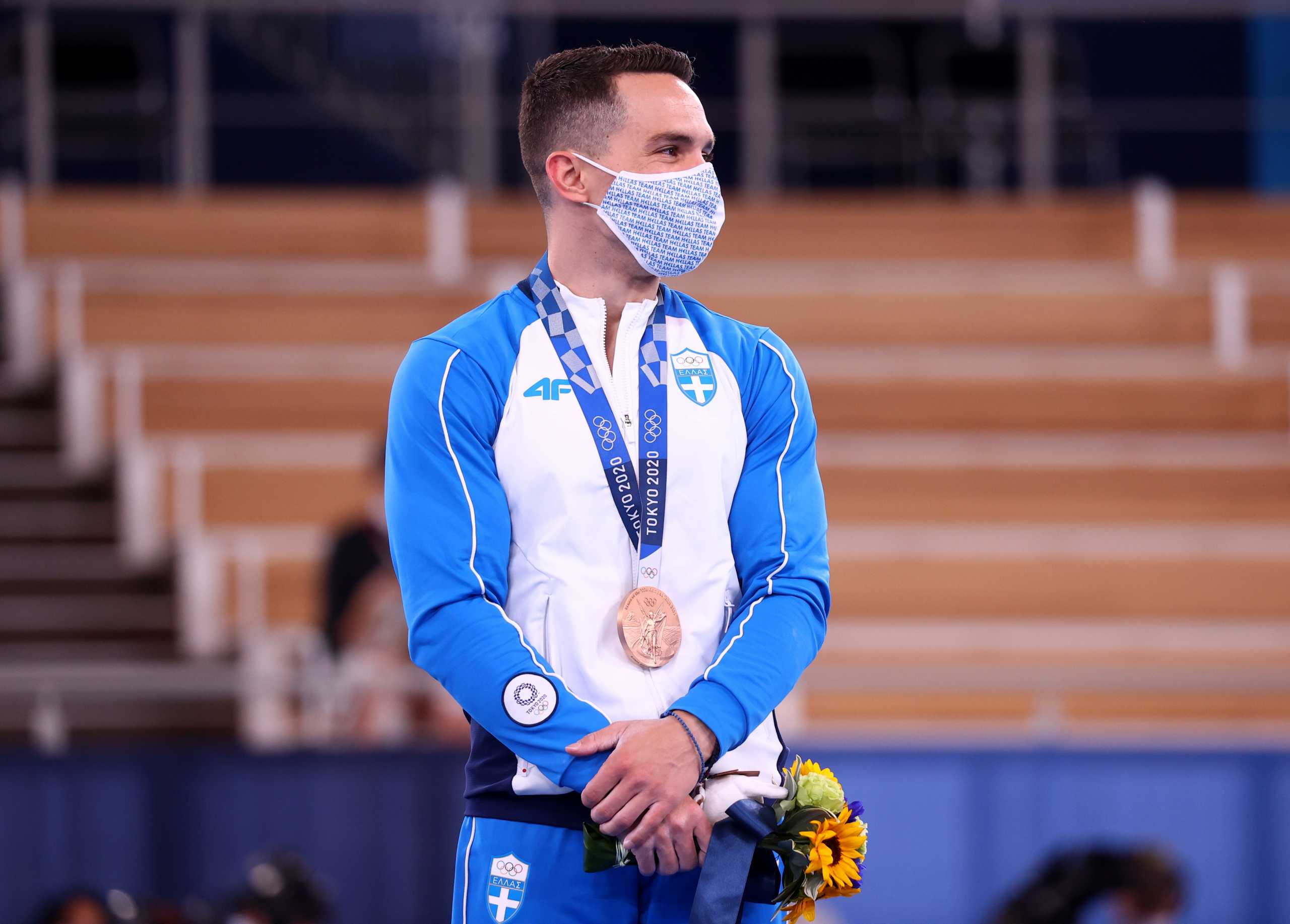 Tokyo 2020 Olympics - Gymnastics - Artistic - Men's Rings - Medal Ceremony - Ariake Gymnastics Centre, Tokyo, Japan - August 2, 2021.  Bronze medallist Eleftherios Petrounias of Greece wearing a protective face mask stands on the podium. REUTERS