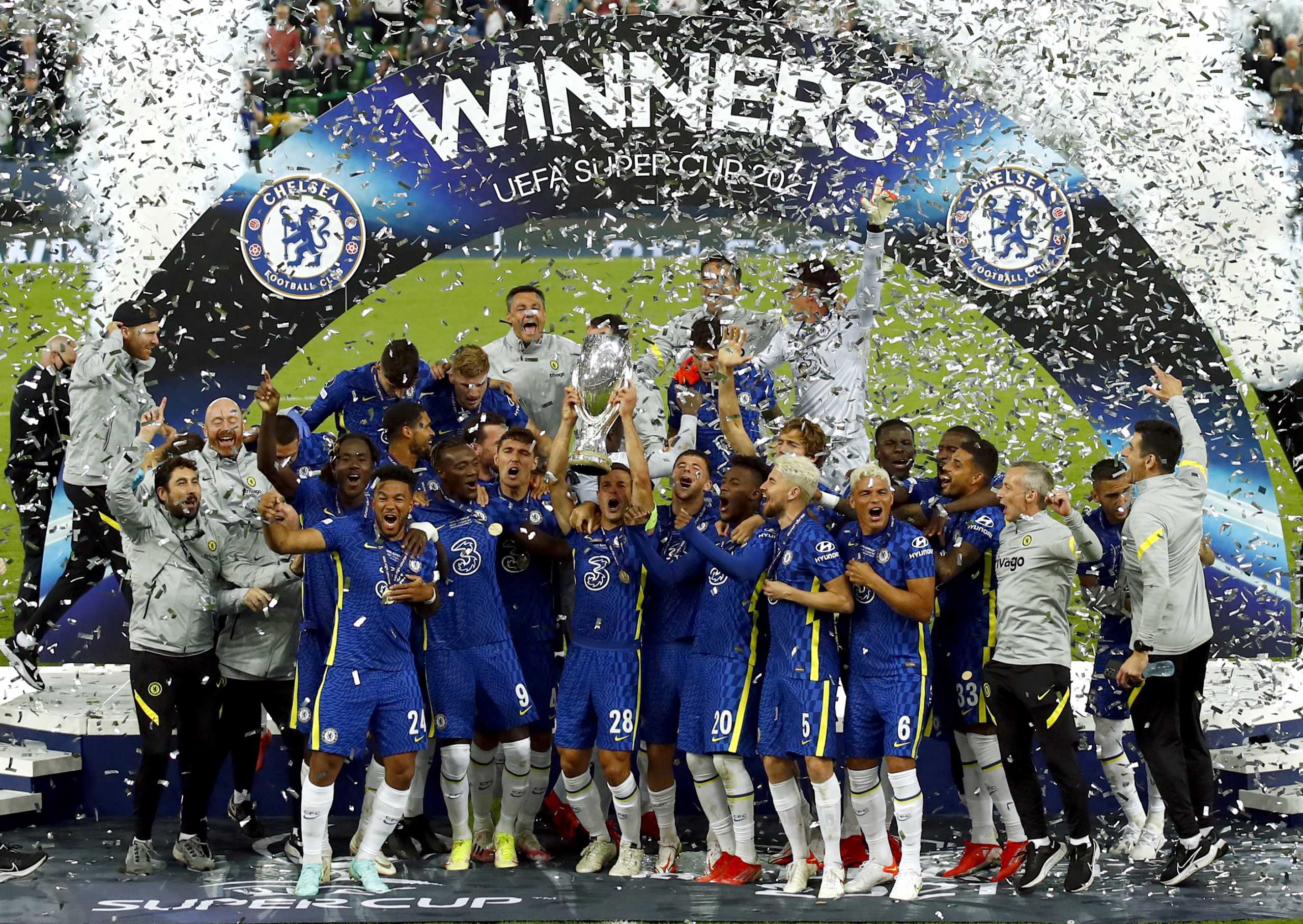 Soccer Football - European Super Cup - Chelsea v Villarreal - Windsor Park, Belfast, Northern Ireland - August 11, 2021 Chelsea's Cesar Azpilicueta and teammates celebrate with the trophy after winning the penalty shoot-out and the European Super Cup Action Images via Reuters