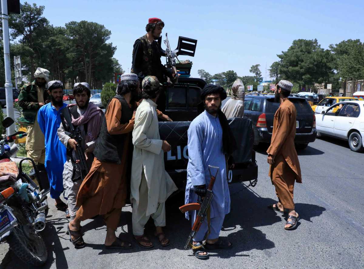 Taliban forces patrol a street in Herat, Afghanistan August 14, 2021. REUTERS