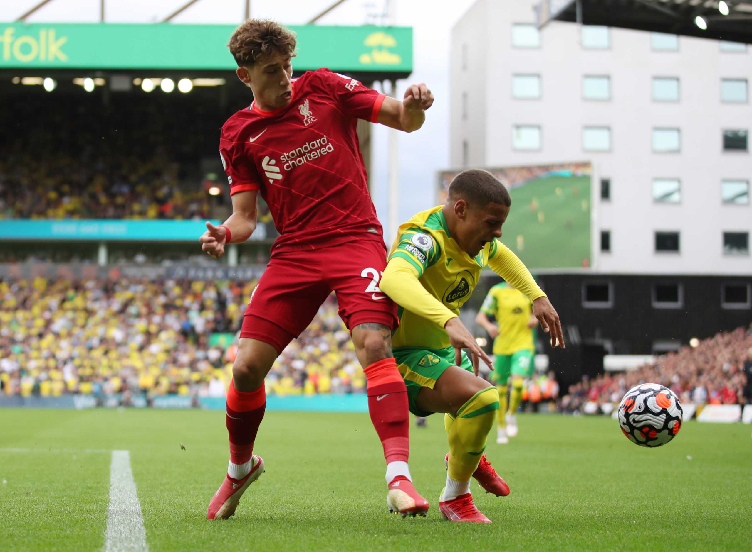 Soccer Football - Premier League - Norwich City v Liverpool - Carrow Road, Norwich, Britain - August 14, 2021 Liverpool's Kostas Tsimikas in action with Norwich City's Max Aarons REUTERS