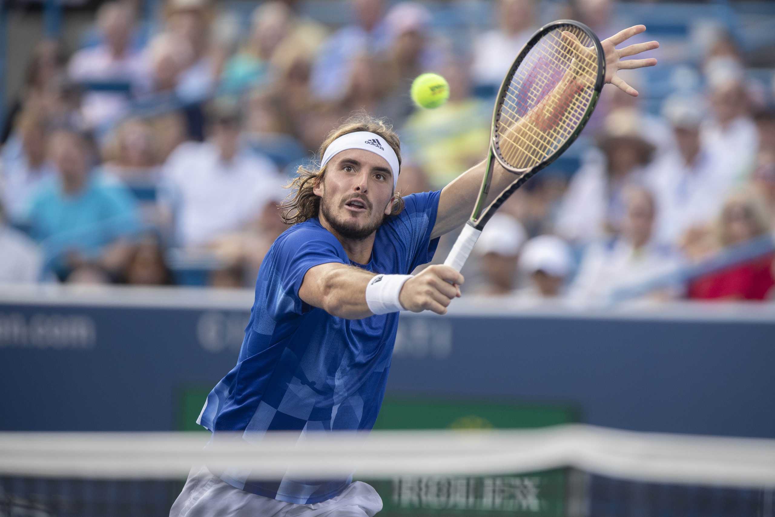 Aug 21, 2021; Mason, OH, USA; Stefanos Tsitsipas (GRE) returns a shot during his  semifinal match against Alexander Zverev (GER not pictured) during the Western and Southern Open at the Lindner Family Tennis Center. Mandatory Credit: Susan Mullane-USA TODAY Sports