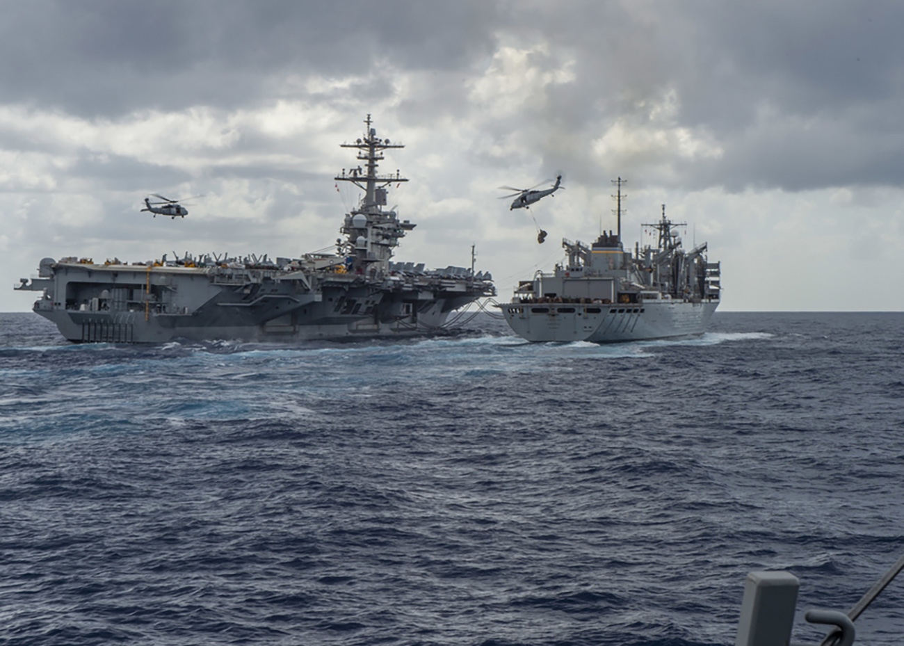epa07568969 A handout photo made available by the US Navy showing the Nimitz-class aircraft carrier USS Abraham Lincoln (CVN 72) conducting a replenishment-at-sea on 08 May 2019, with the fast combat support ship USNS Arctic (T-AOE 9), while MH-60S Sea Hawk helicopters assigned to the 'Nightdippers' of Helicopter Maritime Strike Squadron (HSM) 5, transfer stores between the ships. Abraham Lincoln is underway as part of the Abraham Lincoln Carrier Strike Group (ABECSG) deployment in support of maritime security cooperation efforts in the U.S. 5th, U.S. 6th and U.S. 7th Fleet areas of operation. Media reports on 14 May 2019 state that the US has deployed the USS Abraham Lincoln carrier and other ships to the Gulf of Oman and has sent a team of experienced investigators to the United Arab Emirates (UAE) the United Arab Emirates (UAE) after the UAE Foreign Office reported on 13 May 2019 that four commercial vessels have been targeted by sabotage operations near UAE territorial waters. Saudi Arabia's energy minister Khalid al-Falih added that two Saudi oil tankers had been targeted in the attack.  EPA