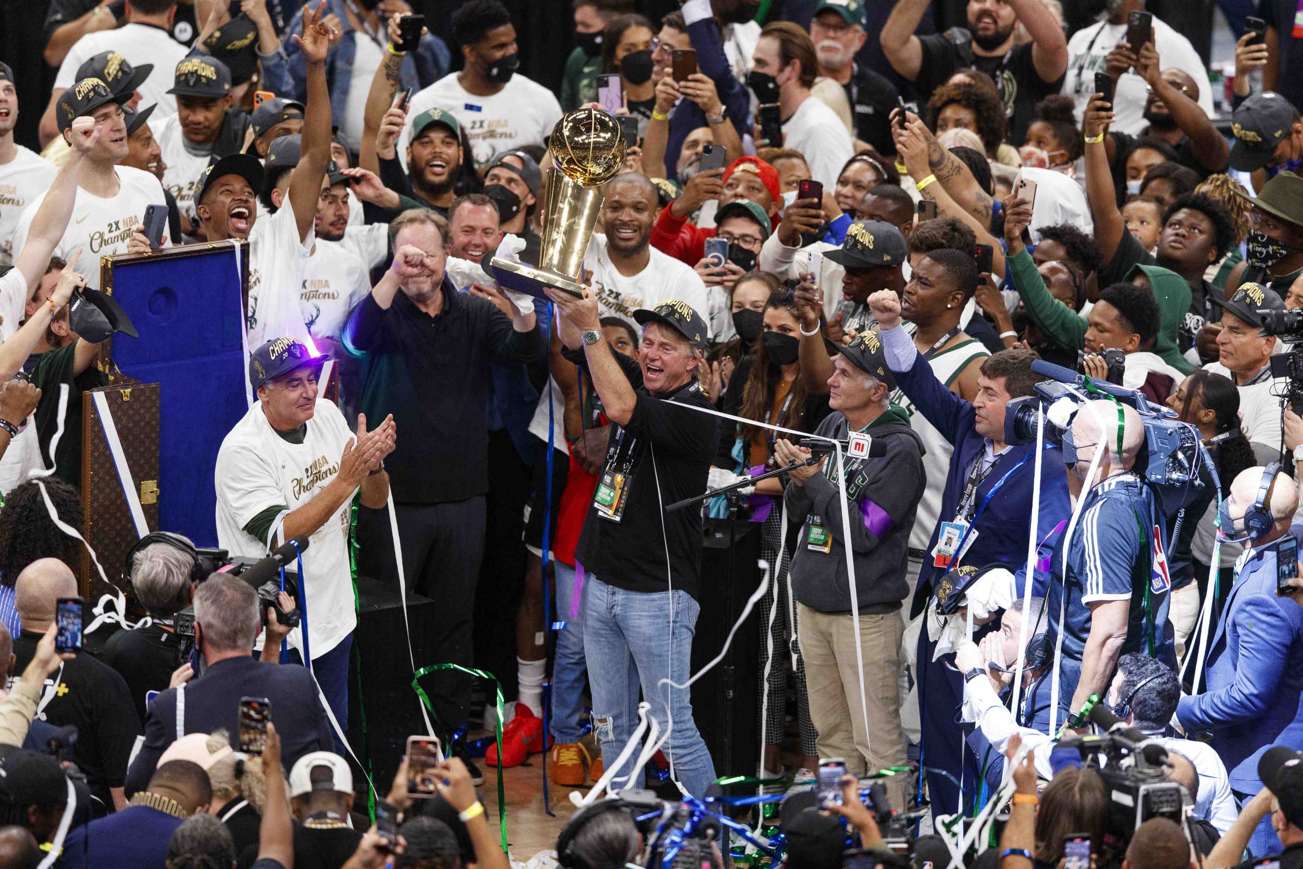 Jul 20, 2021; Milwaukee, Wisconsin, USA; Milwaukee Bucks owner Wes Edens holds up the Larry OÕBrien trophy following game six of the 2021 NBA Finals against the Phoenix Suns at Fiserv Forum. Mandatory Credit: Jeff Hanisch-USA TODAY Sports