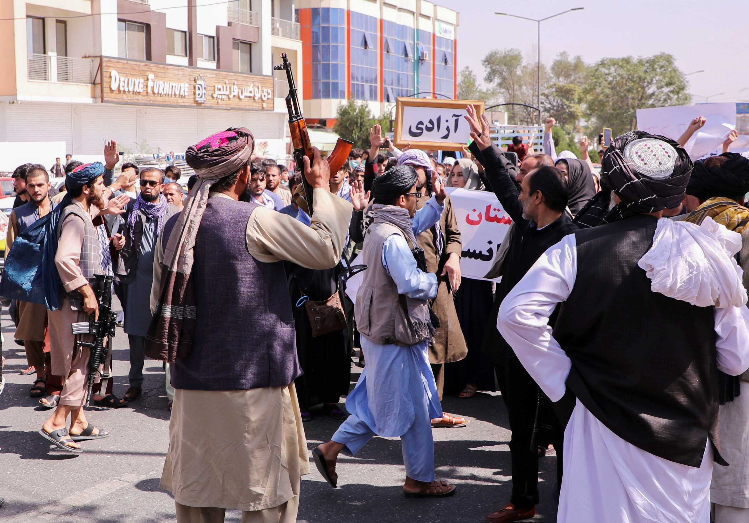 Taliban forces try to stop the protesters, as they shout slogans during an anti-Pakistan protest, near the Pakistan embassy in Kabul, Afghanistan, September 7, 2021. REUTERS