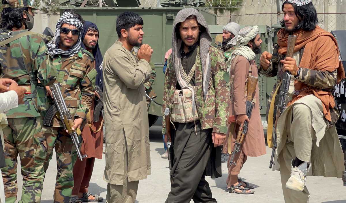 FILE PHOTO: Taliban forces patrol at a runway a day after U.S troops withdrawal from Hamid Karzai International Airport in Kabul, Afghanistan August 31, 2021. REUTERS