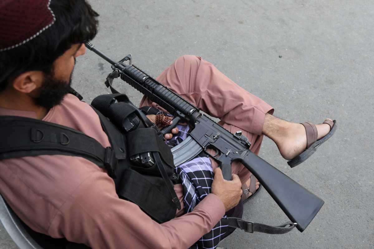 A member of the Taliban sits while holding his gun in Kabul, Afghanistan, September 4, 2021. WANA (West Asia News Agency) via REUTERS ATTENTION EDITORS - THIS IMAGE HAS BEEN SUPPLIED BY A THIRD PARTY.