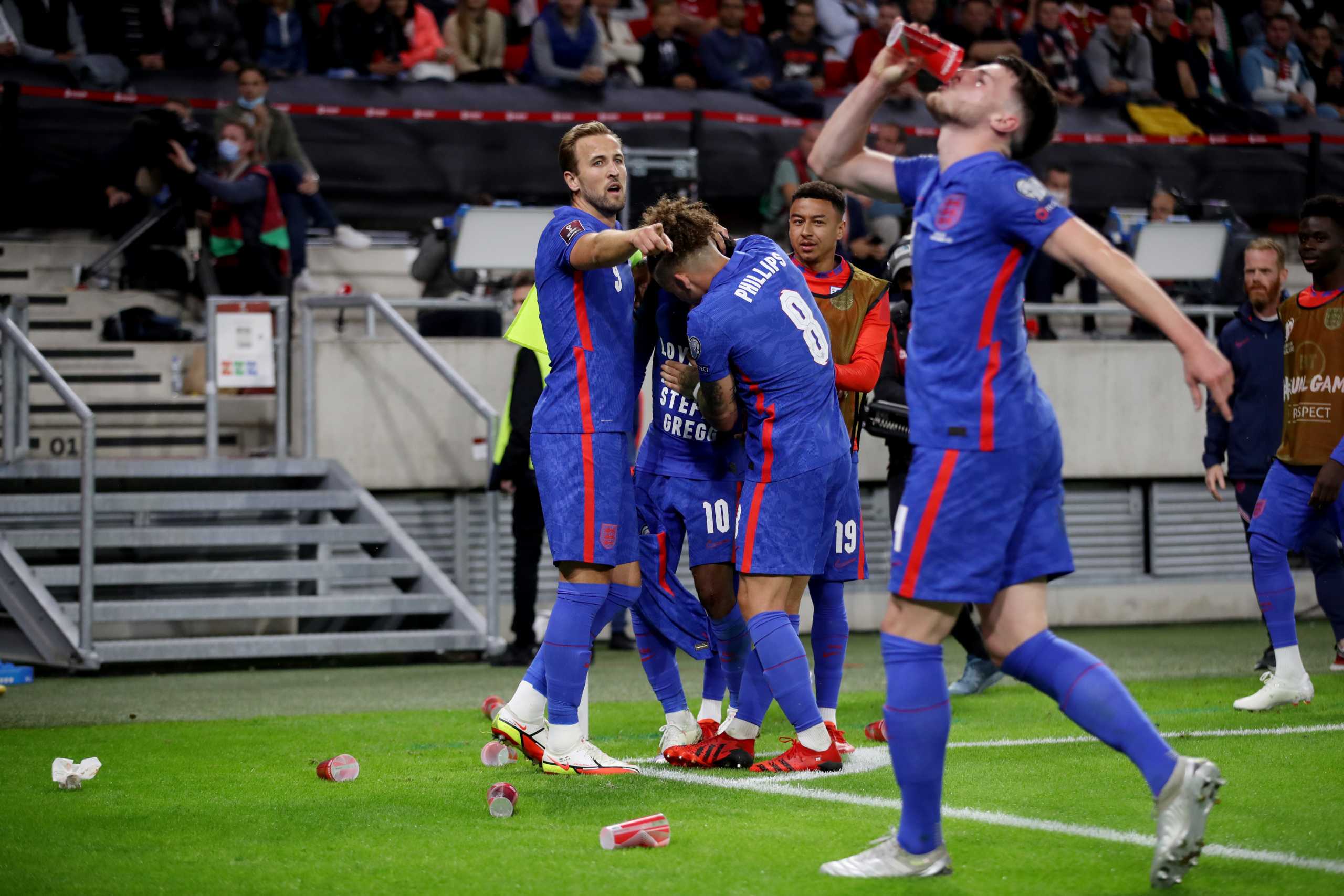 Soccer Football - World Cup - UEFA Qualifiers - Group I - Hungary v England - Puskas Arena, Budapest, Hungary - September 2, 2021 England's Raheem Sterling celebrates scoring their first goal with Harry Kane, Kalvin Phillips and Jesse Lingard as Declan Rice pretends to drink from a plastic cup REUTERS
