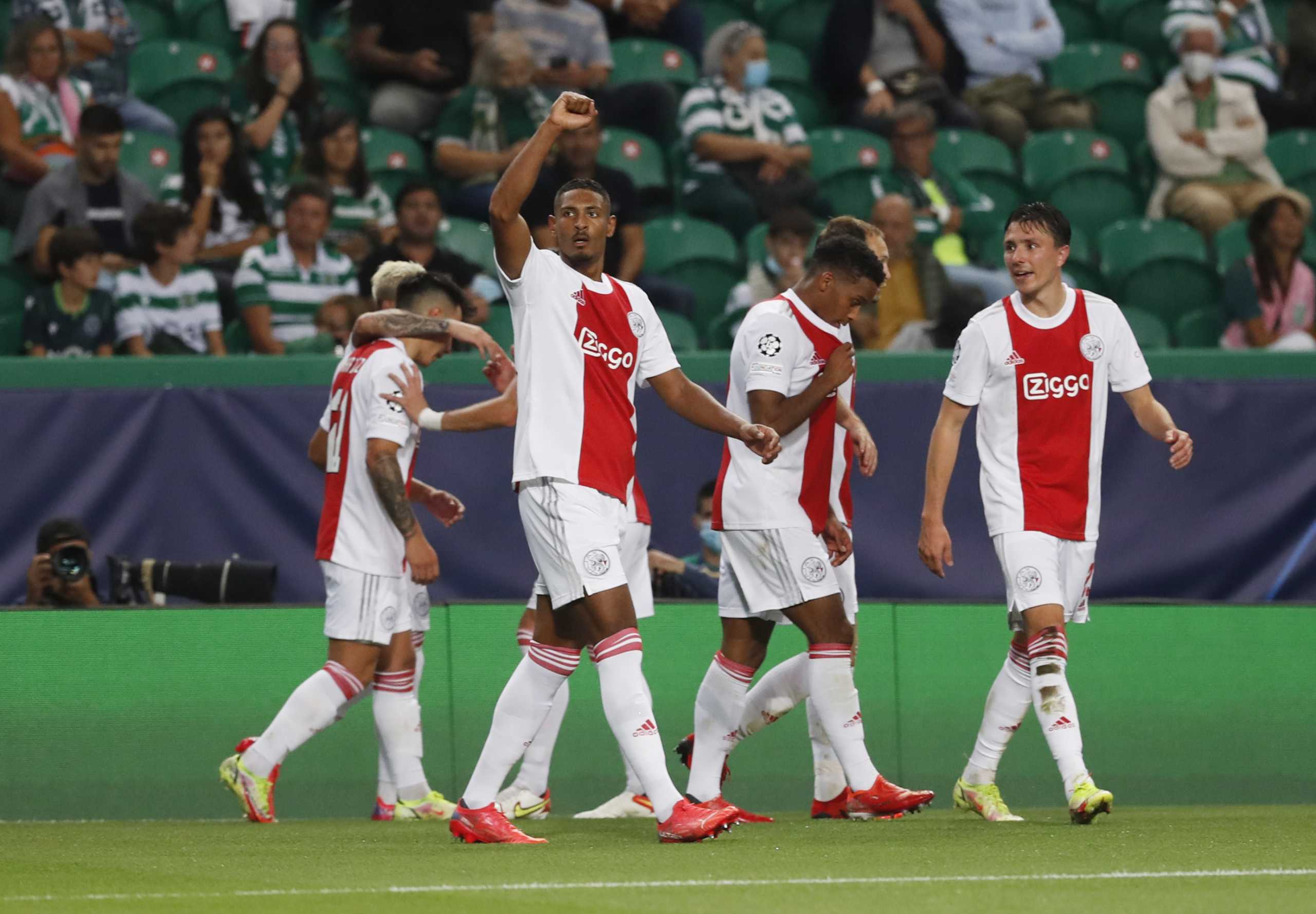 Soccer Football - Champions League - Group C - Sporting Lisbon v Ajax - Jose Alvalade Stadium, Lisbon, Portugal - September 15, 2021 Ajax's Sebastien Haller celebrates scoring their fourth goal with teammates REUTERS