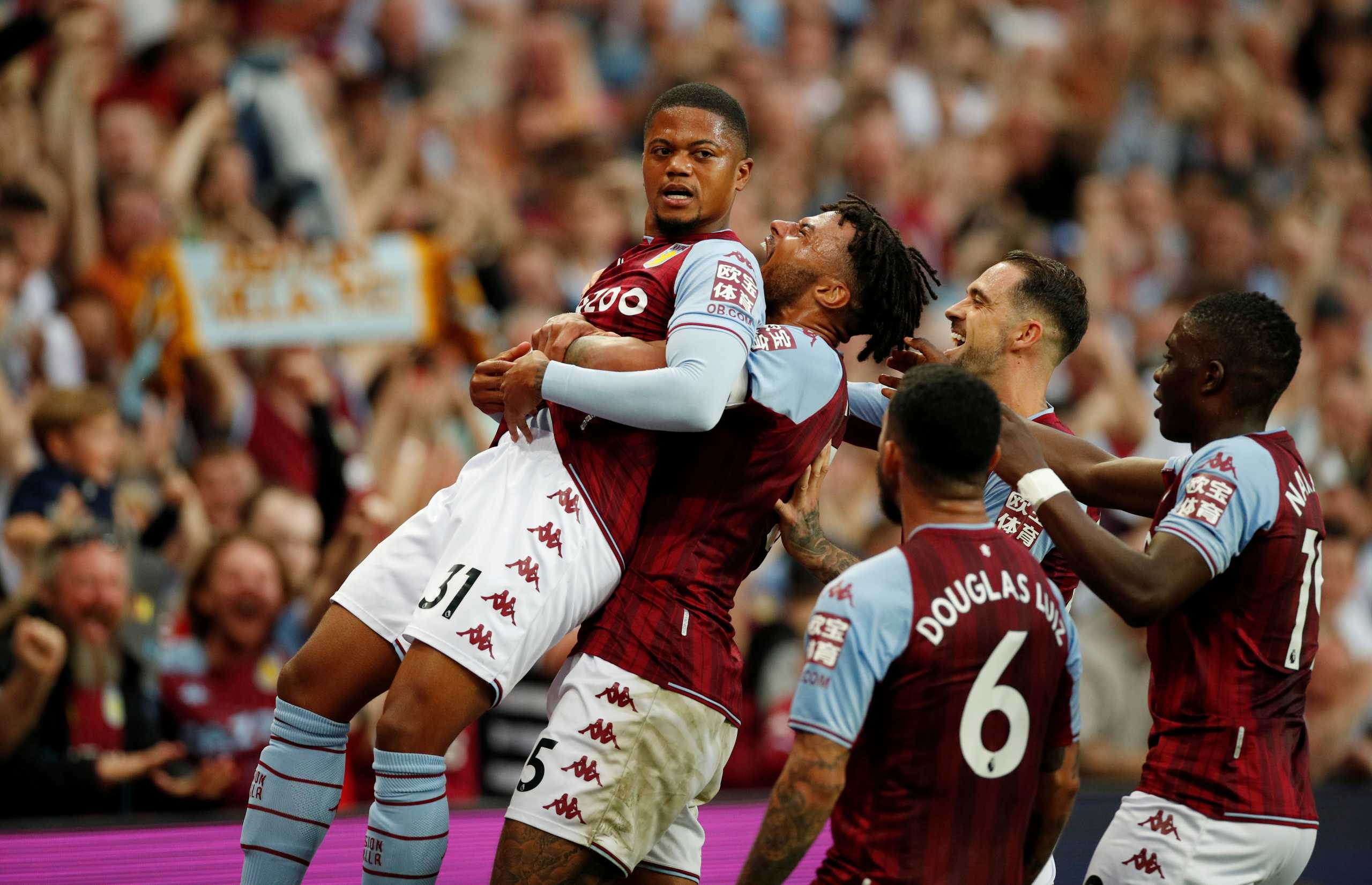 Soccer Football - Premier League - Aston Villa v Everton - Villa Park, Birmingham, Britain - September 18, 2021 Aston Villa's Leon Bailey and Tyrone Mings celebrate after Everton's Lucas Digne scores an own goal and Aston Villa's second Action Images via Reuters