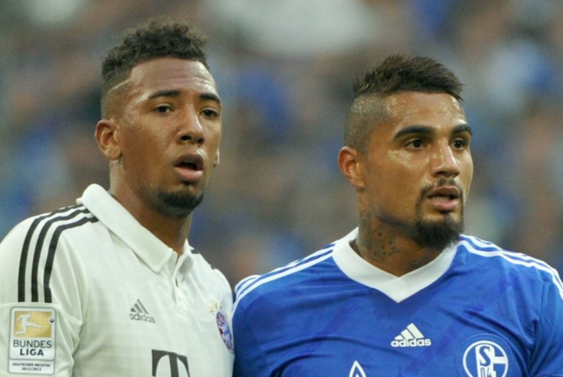 epa03877453 Munich's Jerome Boateng (L) stands next to his half-brother and Schalke player Kevin-Prince Boateng during the Bundesliga soccer match between FC Schalke 04 and FC Bayern Munich at VeltinsArena in Gelsenkirchen, Germany, 21 September 2013.
(ATTENTION: Due to the accreditation guidelines, the DFL only permits the publication and utilisation of up to 15 pictures per match on the internet and in online media during the match.)  EPA
