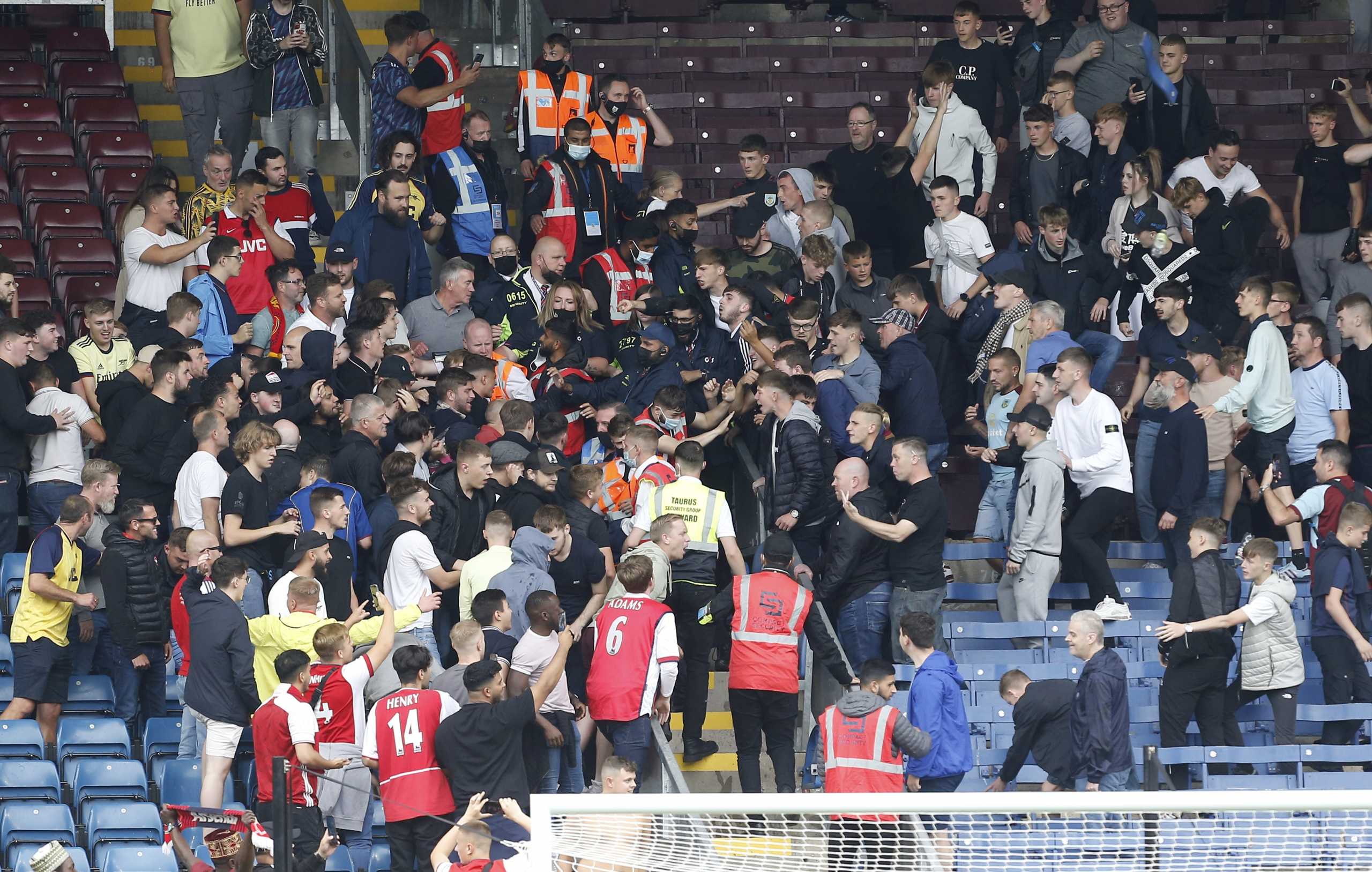 Soccer Football - Premier League - Burnley v Arsenal - Turf Moor, Burnley, Britain - September 18, 2021 Arsenal and Burnley fans clash after the match REUTERS