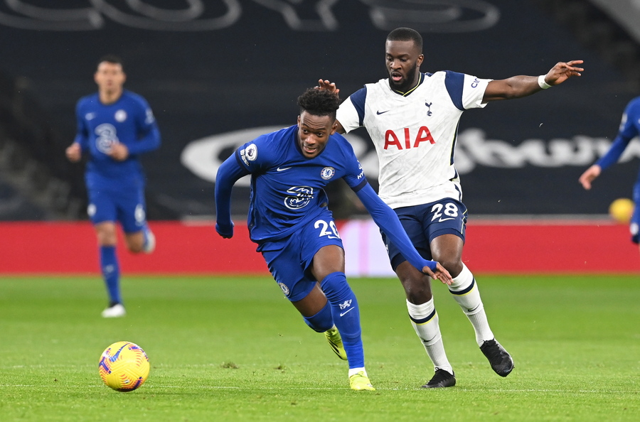 epa08987612 Tanguy Ndombele (R) of Tottenham in action against Callum Hudson-Odoi of Chelsea during the English Premier League soccer match between Tottenham Hotspur and Chelsea FC in London, Britain, 04 February 2021.  EPA