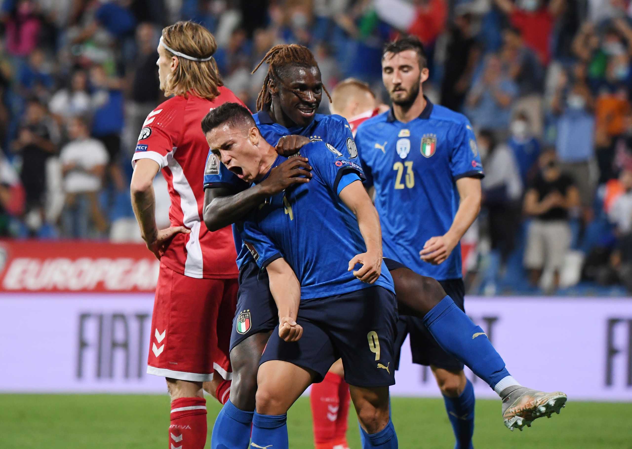 Soccer Football - World Cup - UEFA Qualifiers - Group C - Italy v Lithuania - Mapei Stadium - Citta del Tricolore, Reggio Emilia, Italy - September 8, 2021 Italy's Giacomo Raspadori celebrates scoring their third goal with Moise Kean REUTERS