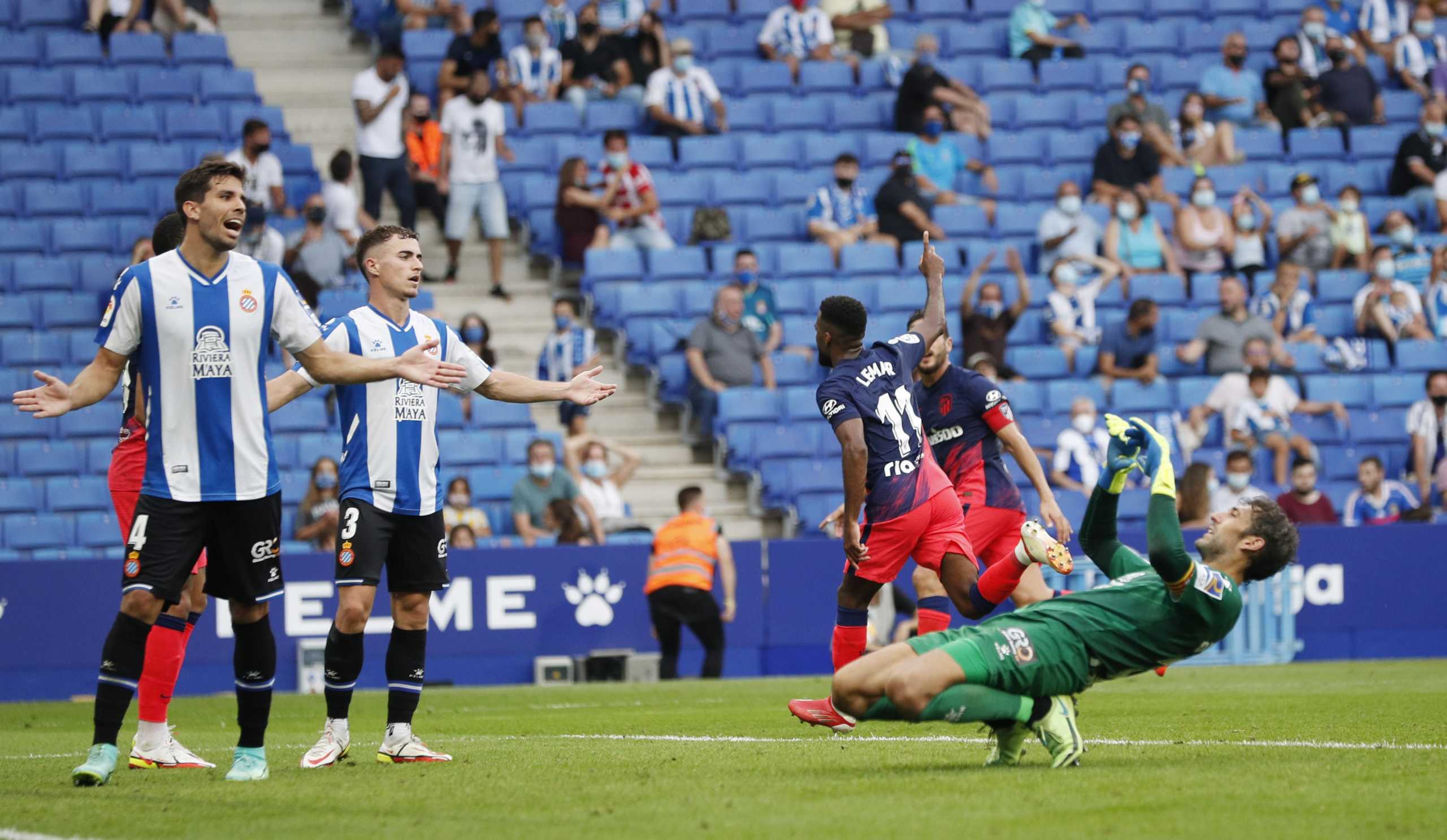 Soccer Football - LaLiga - Espanyol v Atletico Madrid - RCDE Stadium, Barcelona, Spain - September 12, 2021 Atletico Madrid's Thomas Lemar celebrates scoring their second goal as Espanyol's Adria Pedrosa, Leandro Cabrera and Diego Lopez react REUTERS
