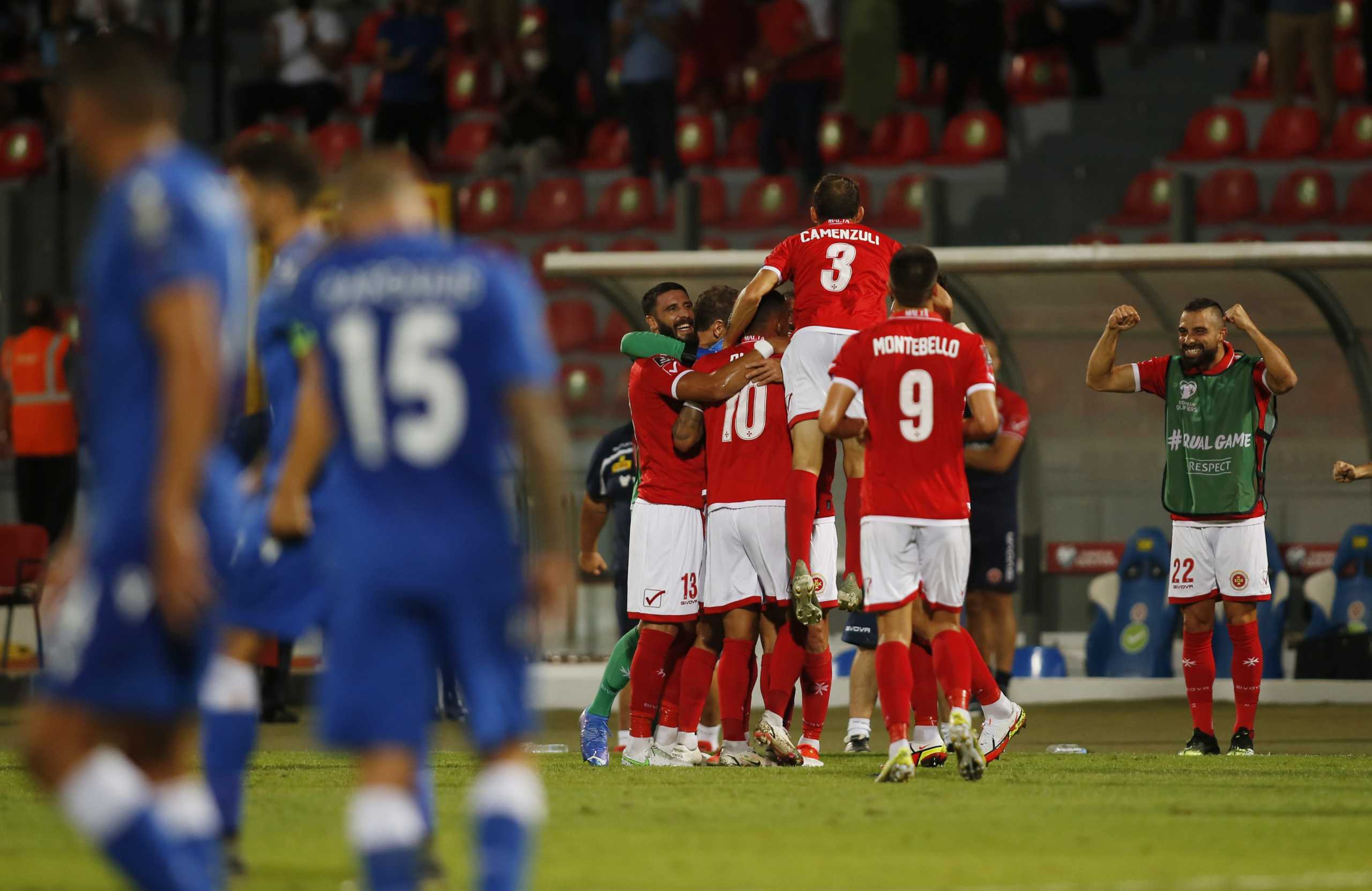 Soccer Football - World Cup - UEFA Qualifiers - Group H - Malta v Cyprus - National Stadium Ta'Qali, Attard, Malta - September 1, 2021  Malta's Cain Attard celebrates scoring their third goal with teammates REUTERS