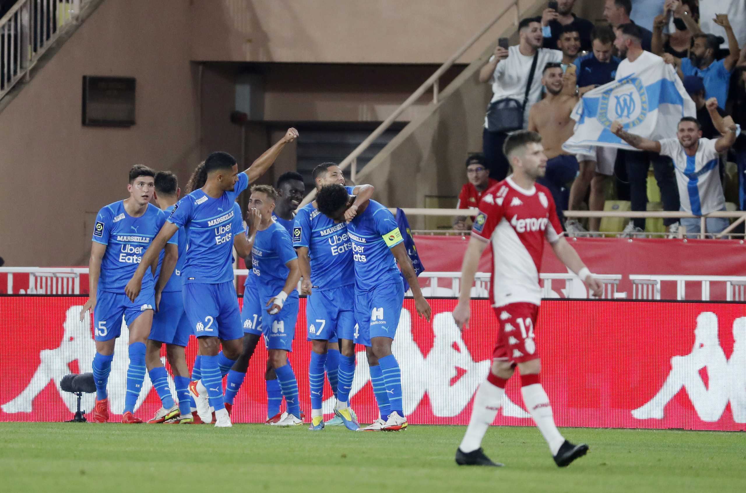 Soccer Football - Ligue 1 - AS Monaco v Olympique de Marseille - Stade Louis II, Monaco - September 11, 2021 Olympique de Marseille's Ahmadou Bamba Dieng celebrates scoring their second goal with teammates REUTERS