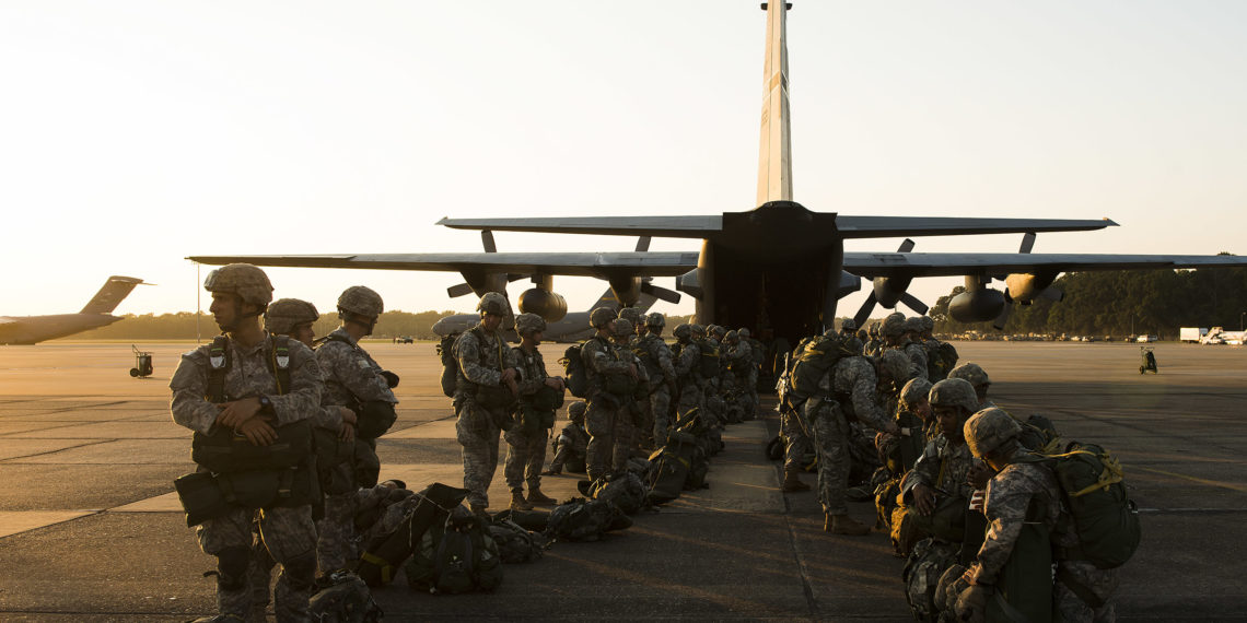 U.S. Army paratroopers from the 82nd Airborne Division perform an equipment check before boarding a C-130H Aug. 18, 2013, at Alexandria International Airport, La. The paratroopers were conducting a static line drop that marked the beginning of Joint Operational Access Exercise 13-0X.  (U.S. Air Force photo by Staff Sgt. Russ Scalf)