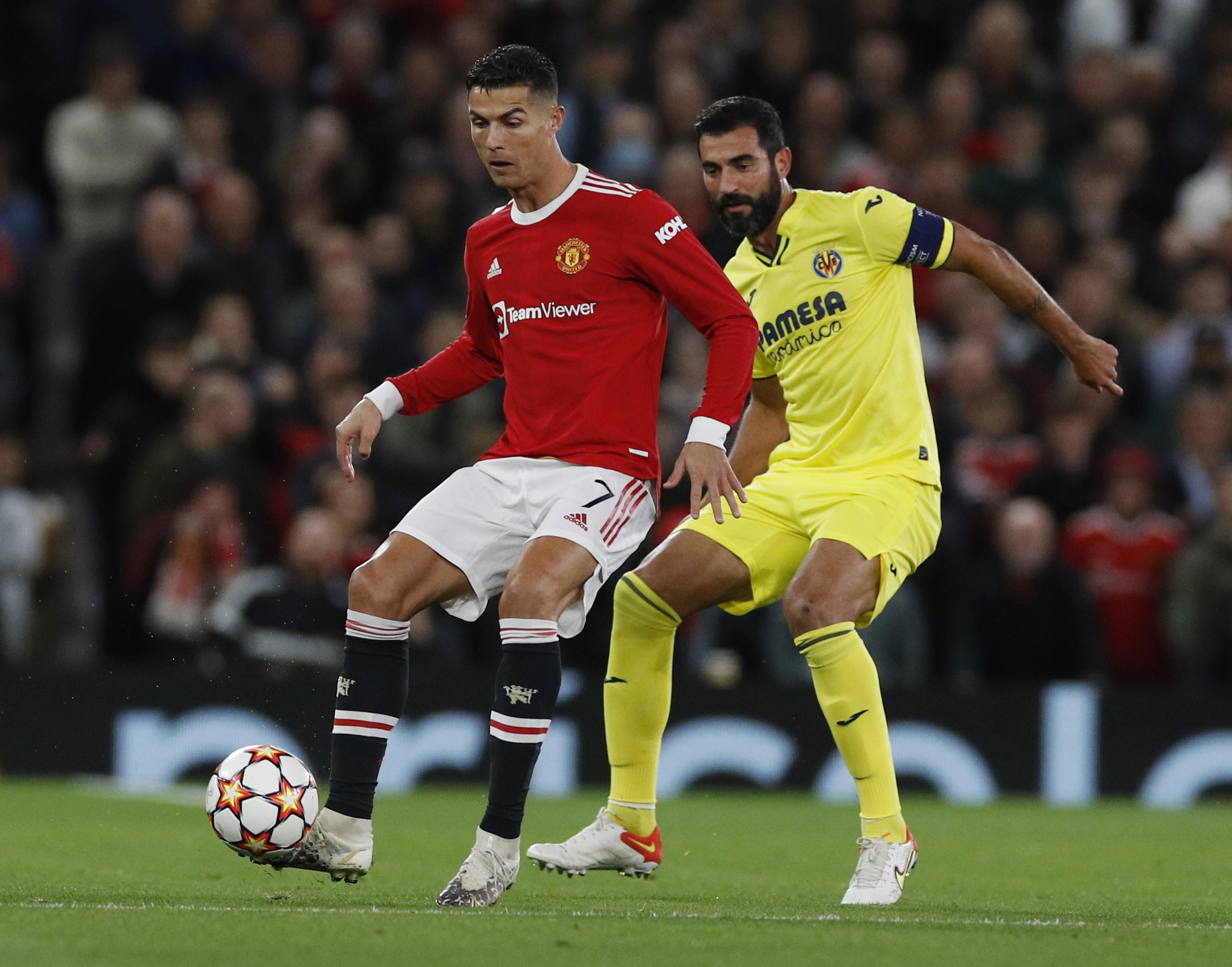 Soccer Football - Champions League - Group F - Manchester United v Villarreal - Old Trafford, Manchester, Britain - September 29, 2021 Manchester United's Cristiano Ronaldo in action with Villarreal's Raul Albiol REUTERS
