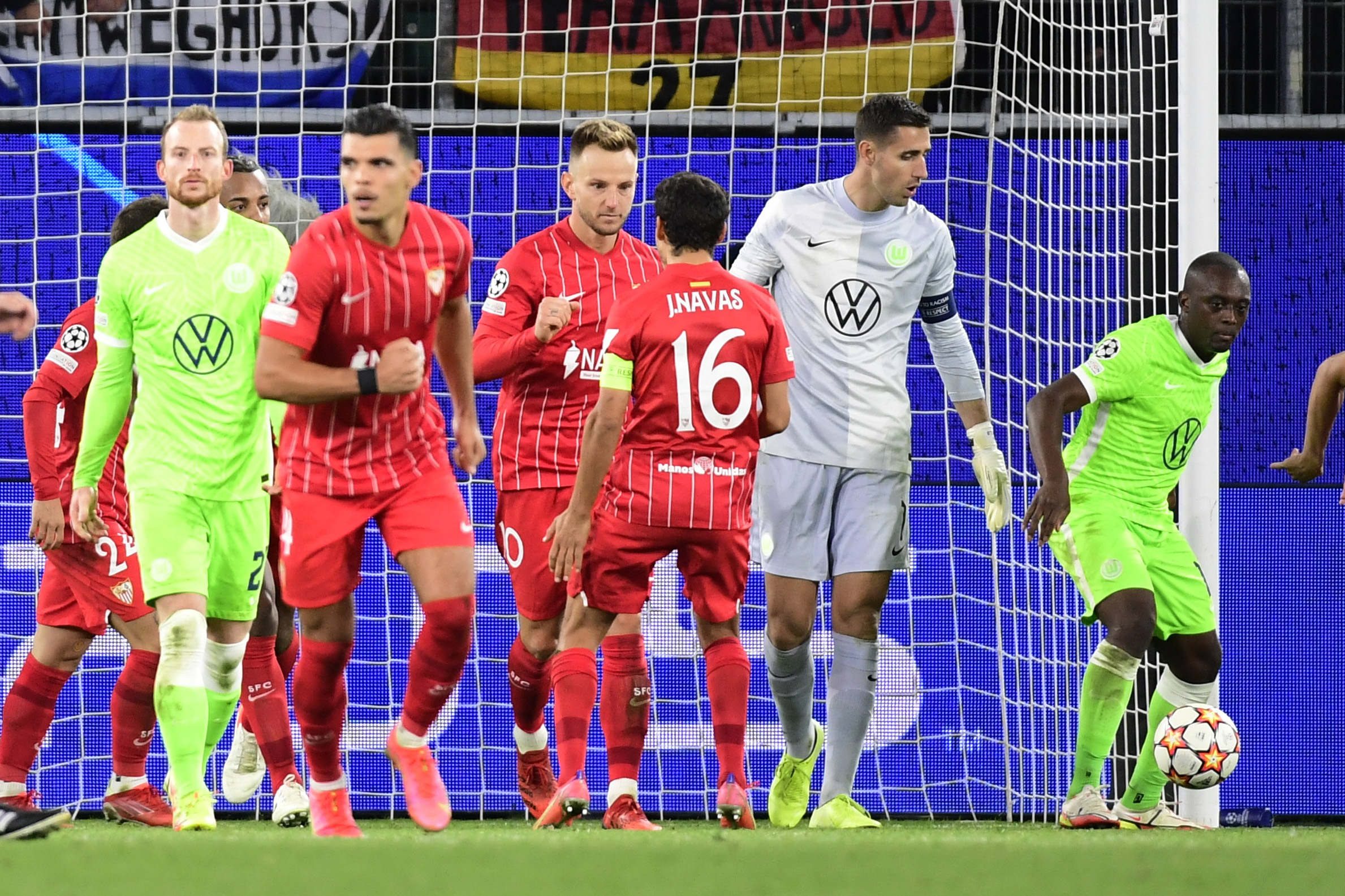 Soccer Football - Champions League - Group G - VfL Wolfsburg v Sevilla - Volkswagen Arena, Wolfsburg, Germany - September 29, 2021 Sevilla's Ivan Rakitic celebrates scoring their first goal with teammates REUTERS