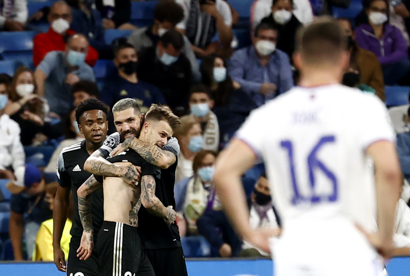 Soccer Football - Champions League - Group D - Real Madrid v Sheriff Tiraspol - Santiago Bernabeu, Madrid, Spain - September 28, 2021 Sheriff Tiraspol's Sebastien Thill celebrates scoring their second goal with Dimitrios Kolovos REUTERS