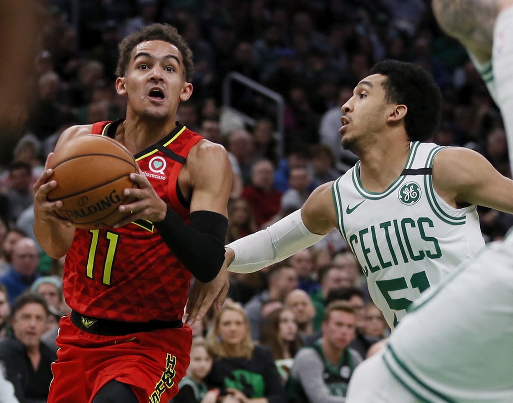 epa08100923 Atlanta Hawks guard Trae Young drives to the basket as Boston Celtics guard Tremont Waters (R) defends during the first half of the NBA basketball game between the Atlanta Hawks and the Boston Celtics at the TD Garden in Boston, Massachusetts, USA, 03 January 2020.  EPA