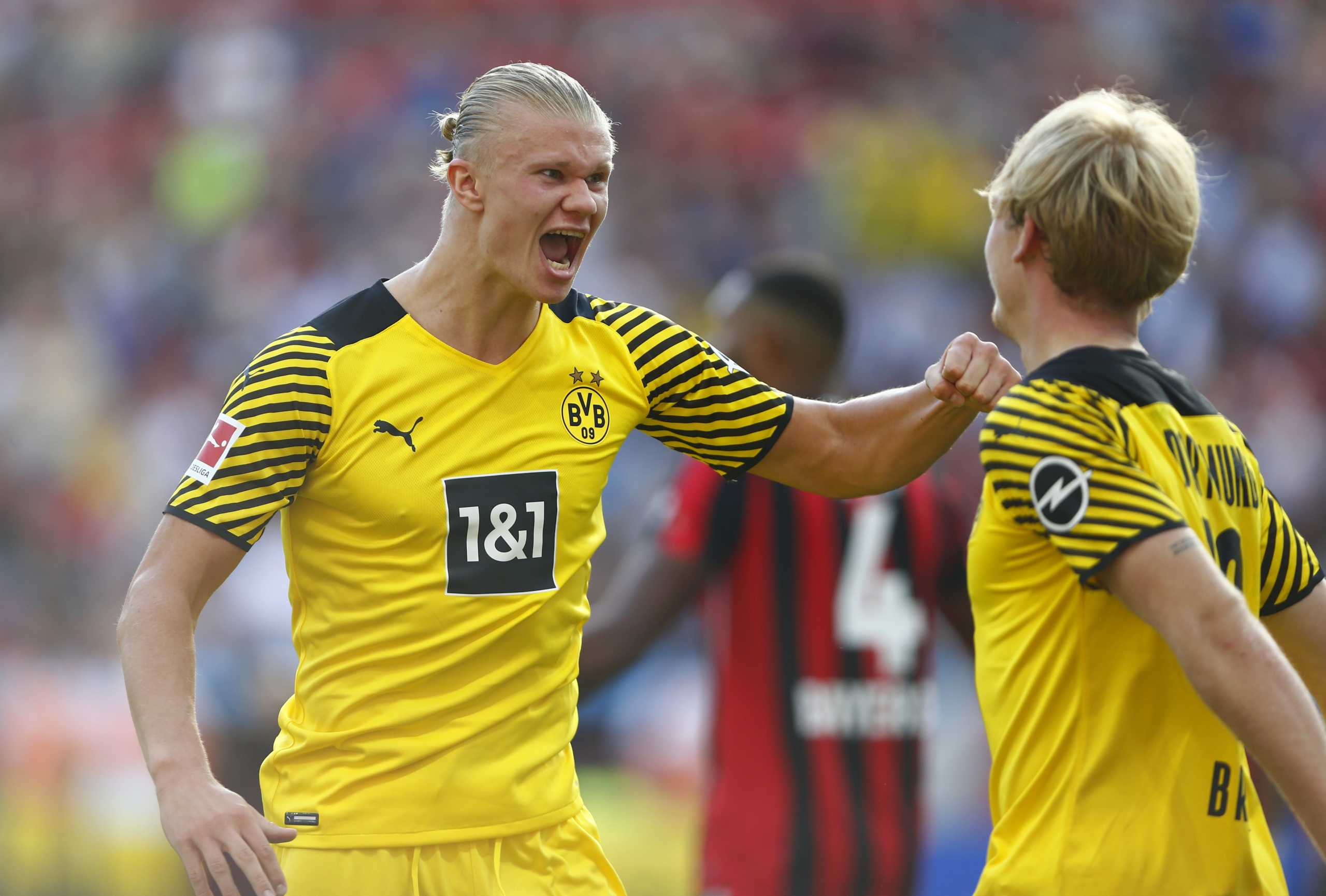 Soccer Football - Bundesliga - Bayer Leverkusen v Borussia Dortmund - BayArena, Leverkusen, Germany - September 11, 2021 Borussia Dortmund's Erling Haaland celebrates with Julian Brandt after scoring their second goal REUTERS