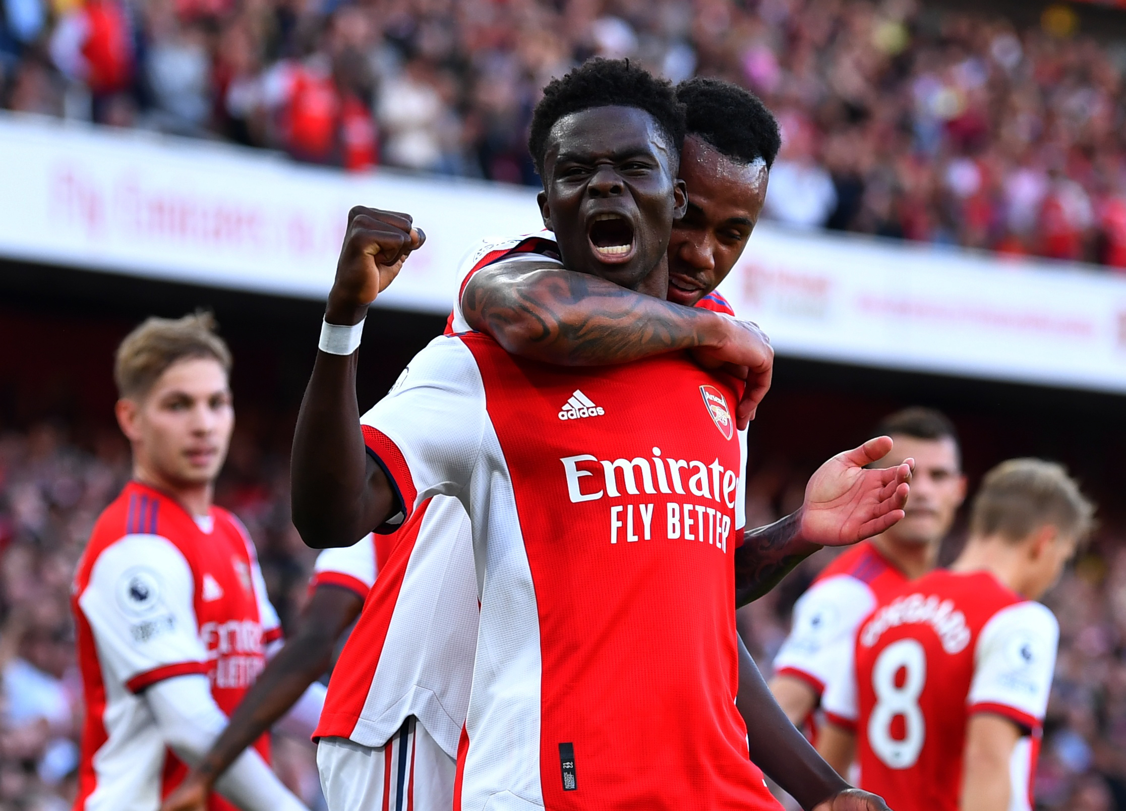 Soccer Football - Premier League - Arsenal v Tottenham Hotspur - Emirates Stadium, London, Britain - September 26, 2021  Arsenal's Bukayo Saka celebrates scoring their third goal with Gabriel REUTERS