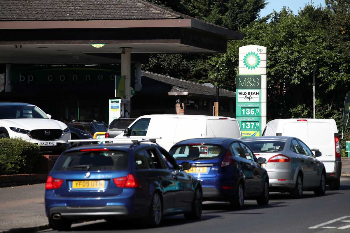 Vehicles queue up to enter the BP petrol station, in Harpenden, Britain, September 24, 2021.  REUTERS