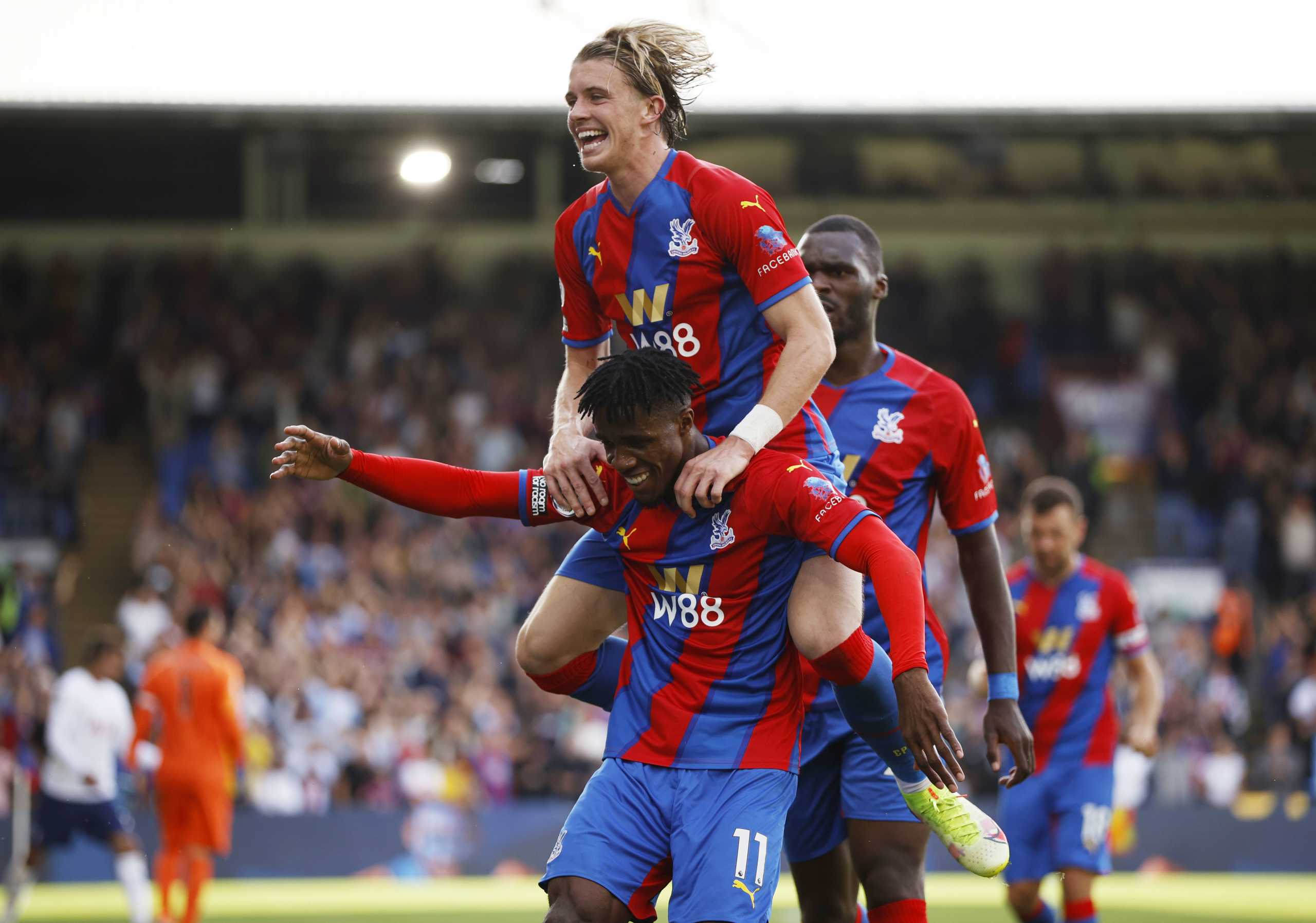 Soccer Football - Premier League - Crystal Palace v Tottenham Hotspur - Selhurst Park, London, Britain - September 11, 2021 Crystal Palace's Wilfried Zaha celebrates scoring their first goal with Conor Gallagher Action Images via Reuters