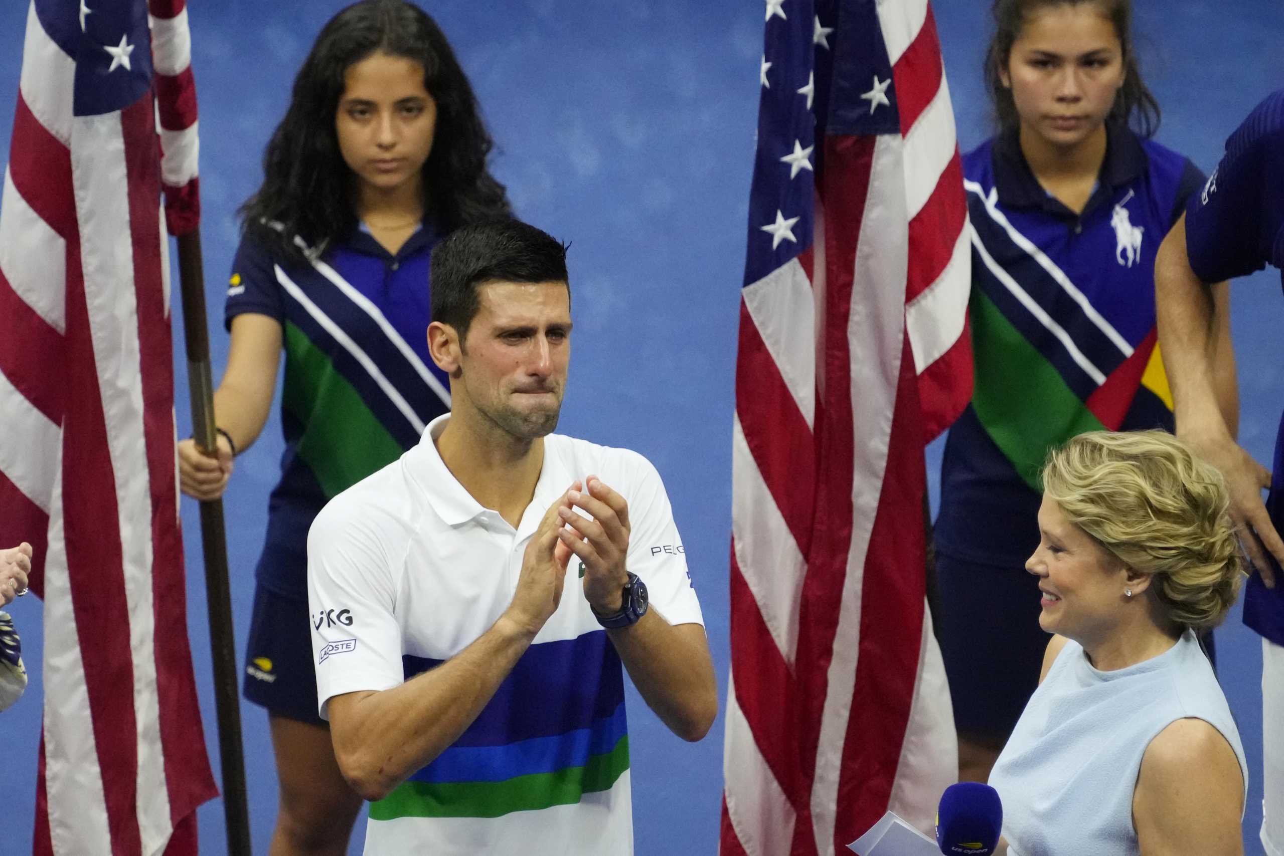 Sep 12, 2021; Flushing, NY, USA; Novak Djokovic of Serbia  (L) is overcome with emotion during an interview with ESPN hist Chris McKendry (R) during the trophy ceremony after his match against Daniil Medvedev of Russia (not pictured) in the men's singles final on day fourteen of the 2021 U.S. Open tennis tournament at USTA Billie Jean King National Tennis Center. Mandatory Credit: Robert Deutsch-USA TODAY Sports