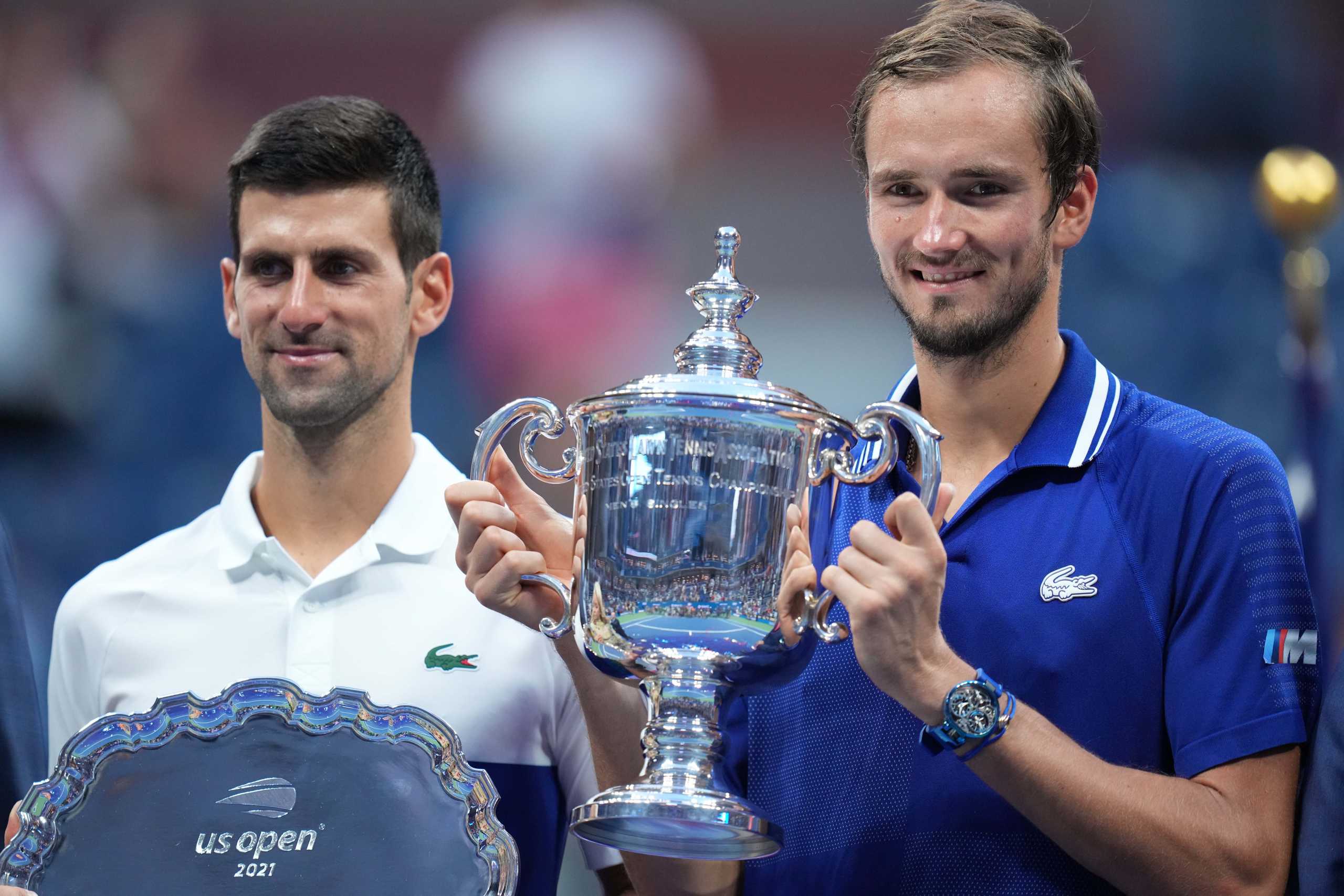 Sep 12, 2021; Flushing, NY, USA; (L-R) Novak Djokovic of Serbia and Daniil Medvedev of Russia celebrate with the finalist and championship trophies, respectively, after their match in the men's singles final on day fourteen of the 2021 U.S. Open tennis tournament at USTA Billie Jean King National Tennis Center. Mandatory Credit: Danielle Parhizkaran-USA TODAY Sports