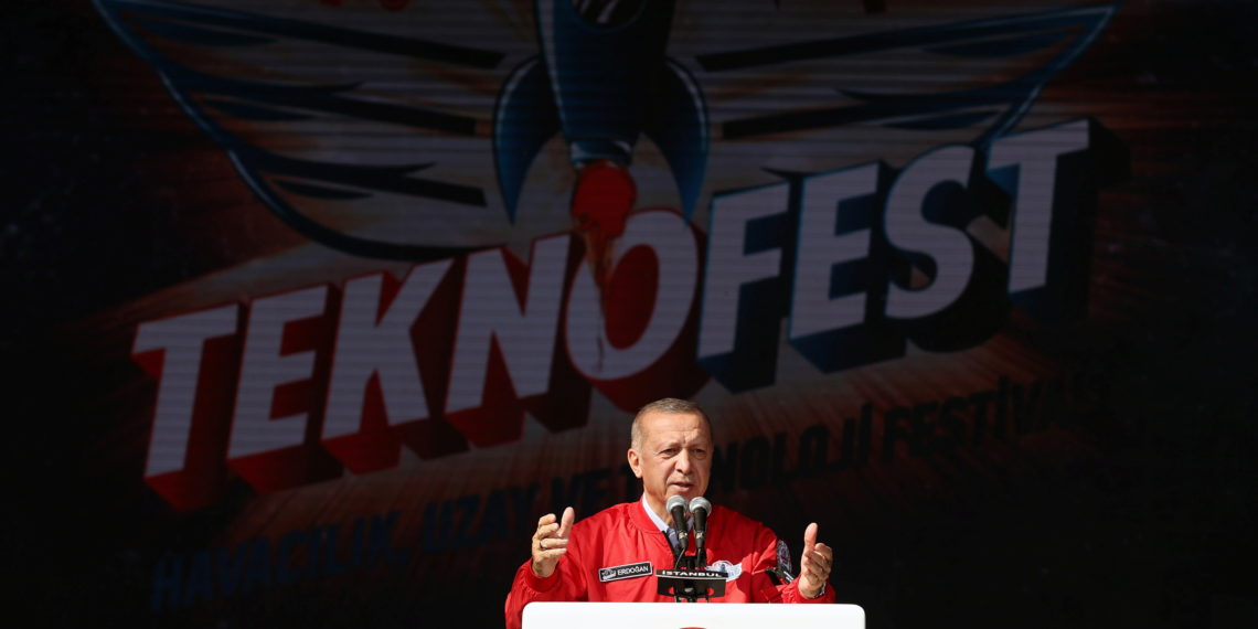 Turkish President Tayyip Erdogan addresses the audience as he visits Teknofest airshow in Istanbul, Turkey, September 25, 2021. Murat Cetinmuhurdar