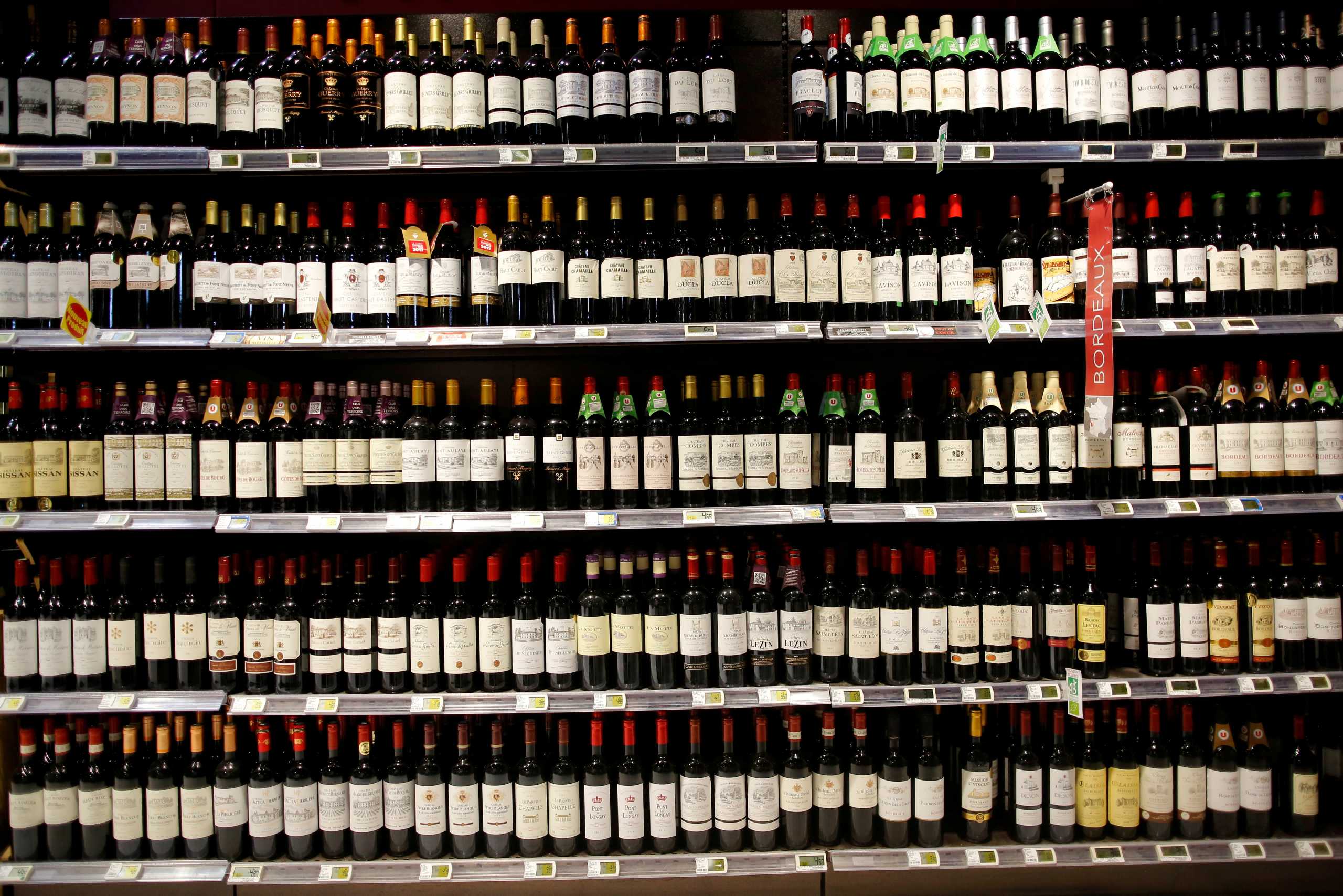 FILE PHOTO: Bottles of French wine are displayed for sale in a supermarket in Vertou, near Nantes, France, June 20, 2017.   REUTERS