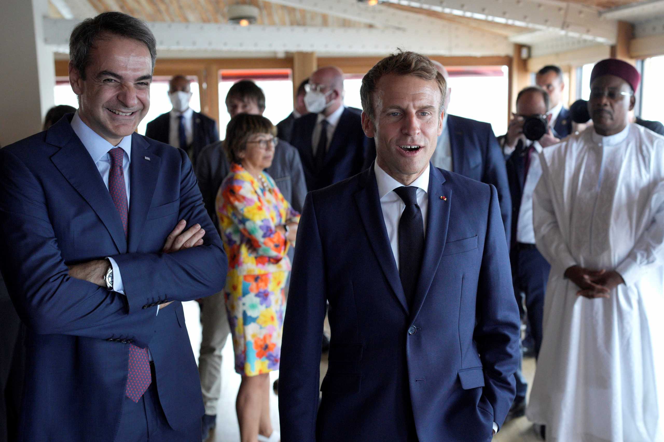 French President Emmanuel Macron and Greek Prime Minister Kyriakos Mitsotakis react as they arrive for lunch at Peron restaurant on the Corniche Kennedy, on the first day of the World Conservation Congress, a global biodiversity conference, in Marseille, France September 3, 2021. Daniel Cole